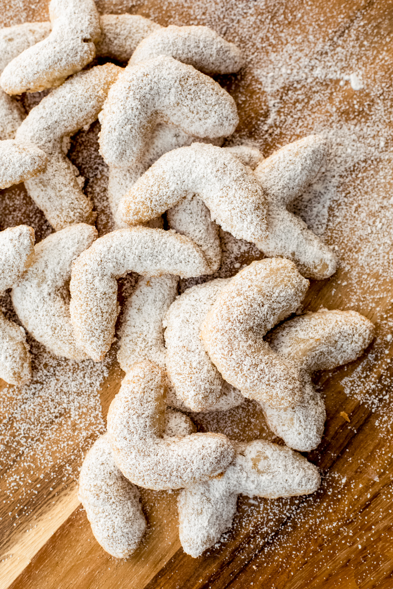 crescent cookies dusted with powdered sugar.