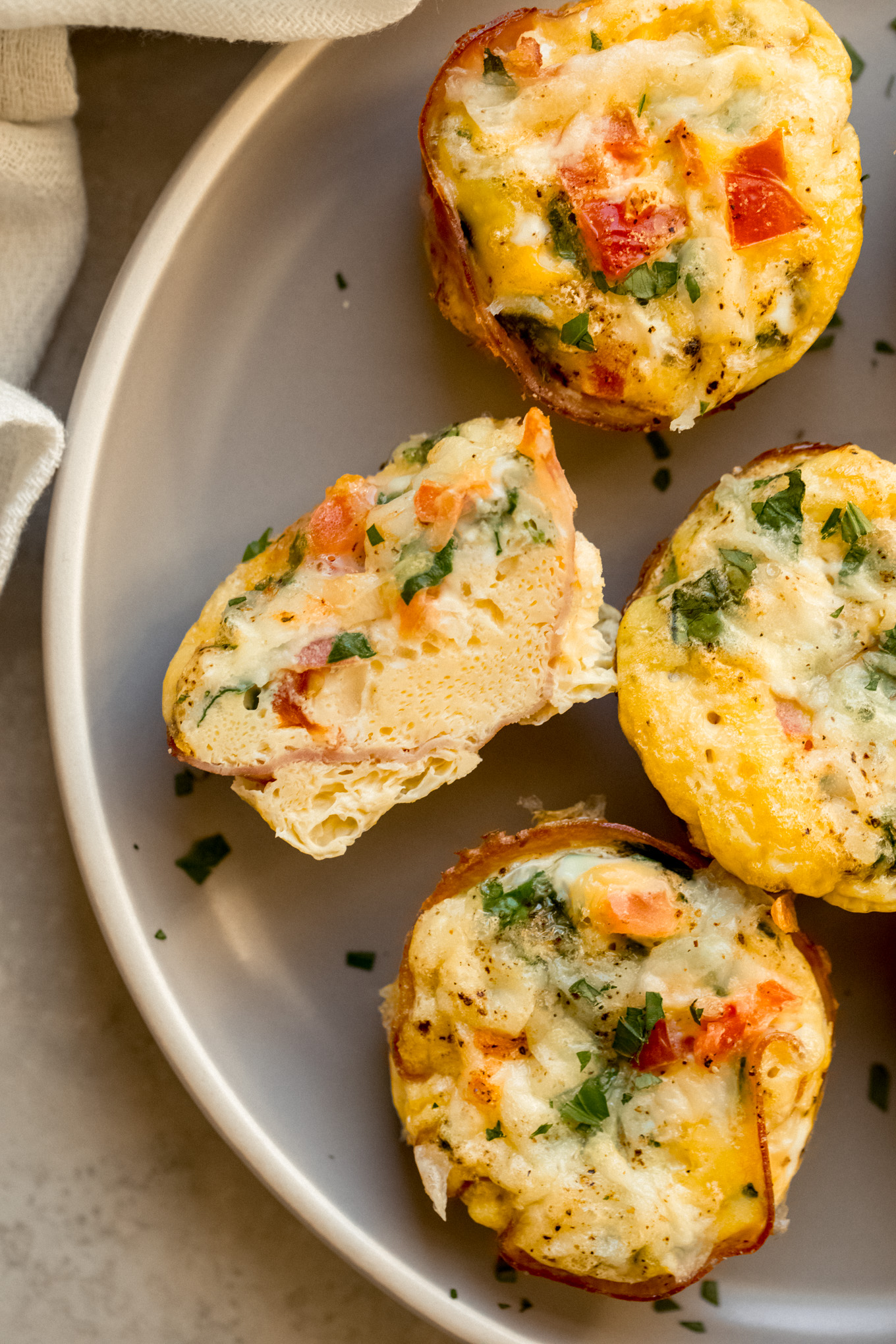 cut up egg muffin on a plate.