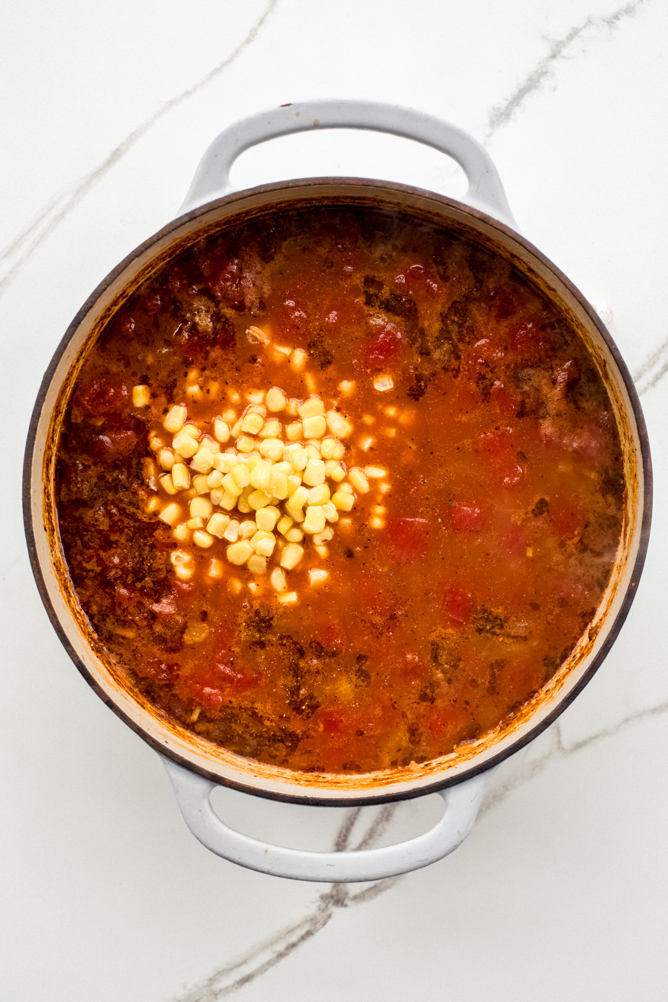 corn in a tomato based soup.