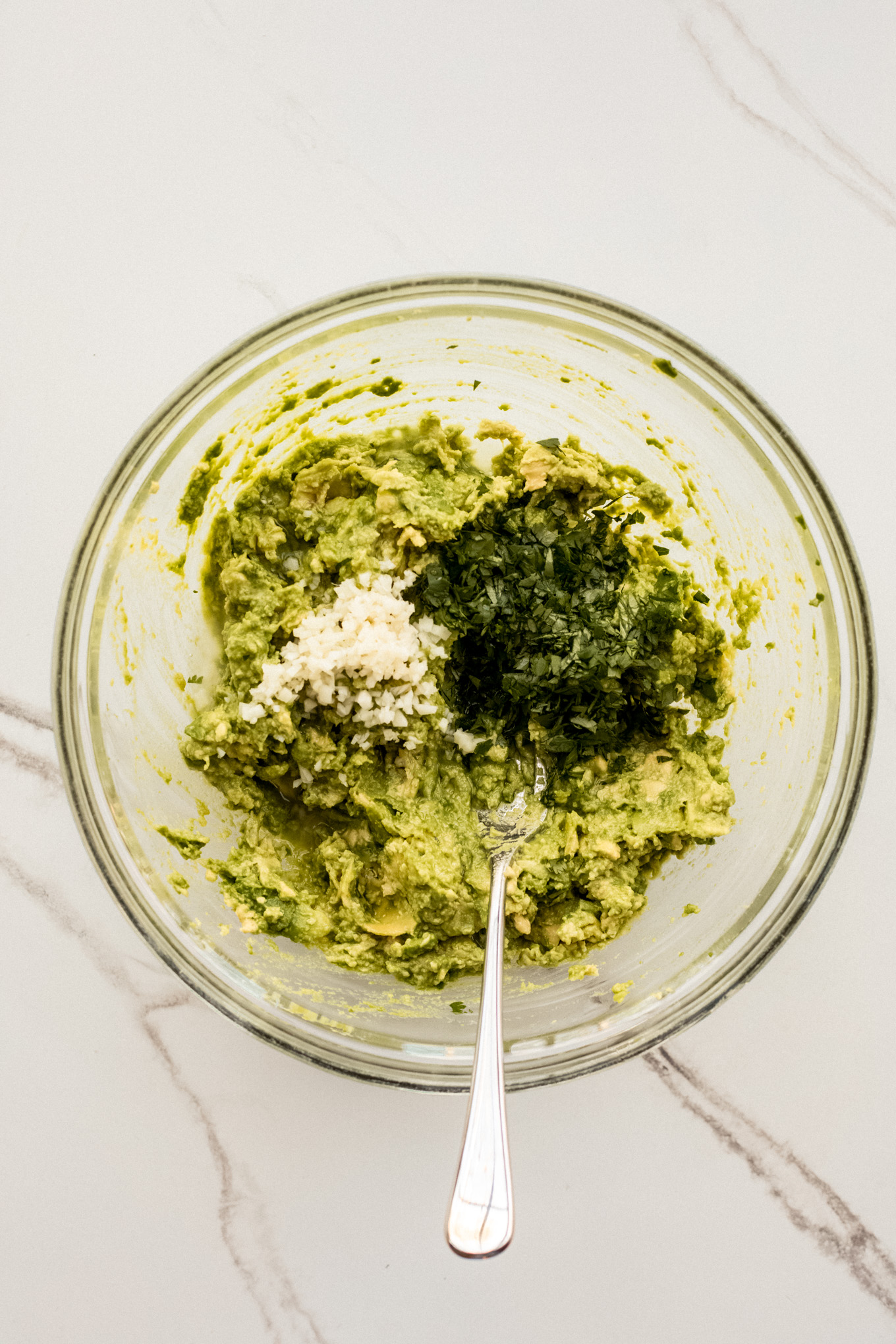 garlic and cilantro over mashed avocados.