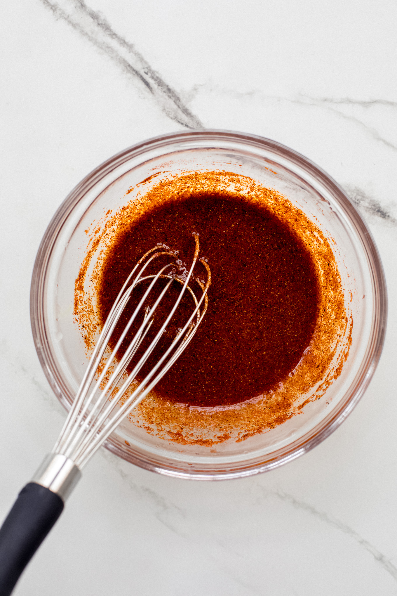 spices with oil in a bowl.