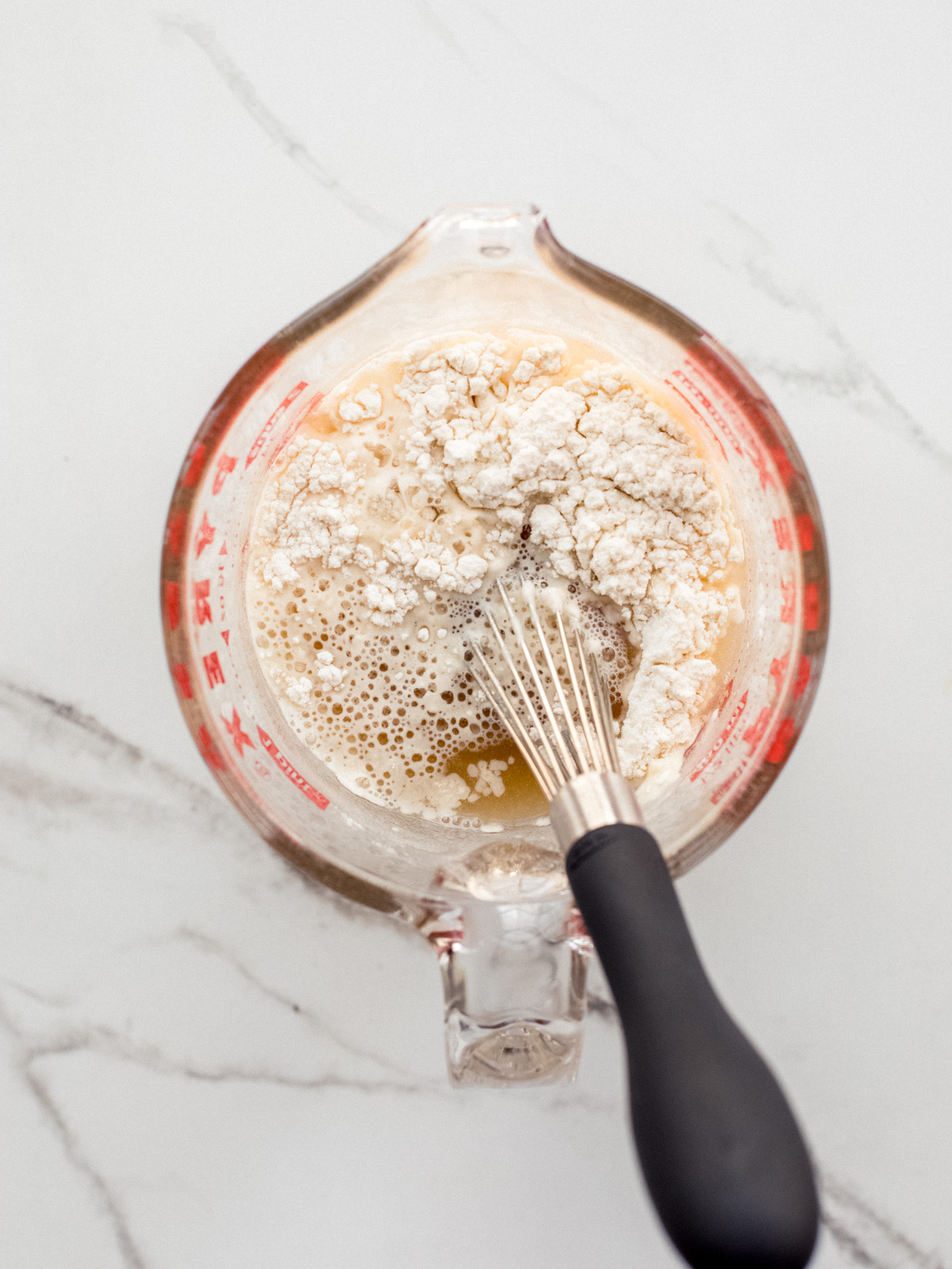 flour with stock in a measuring cup.
