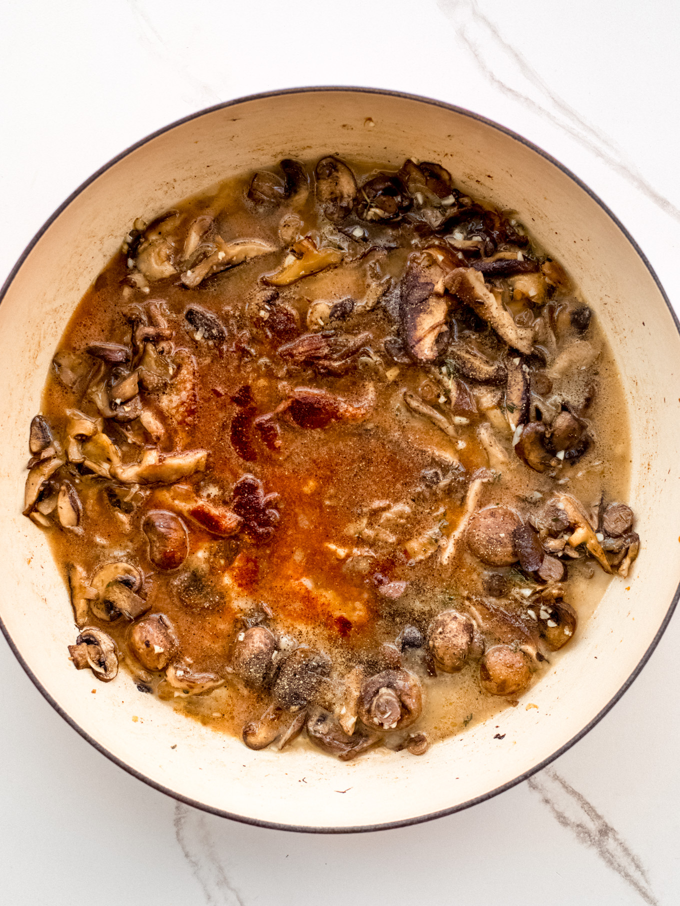 cooked mushrooms in a liquid.
