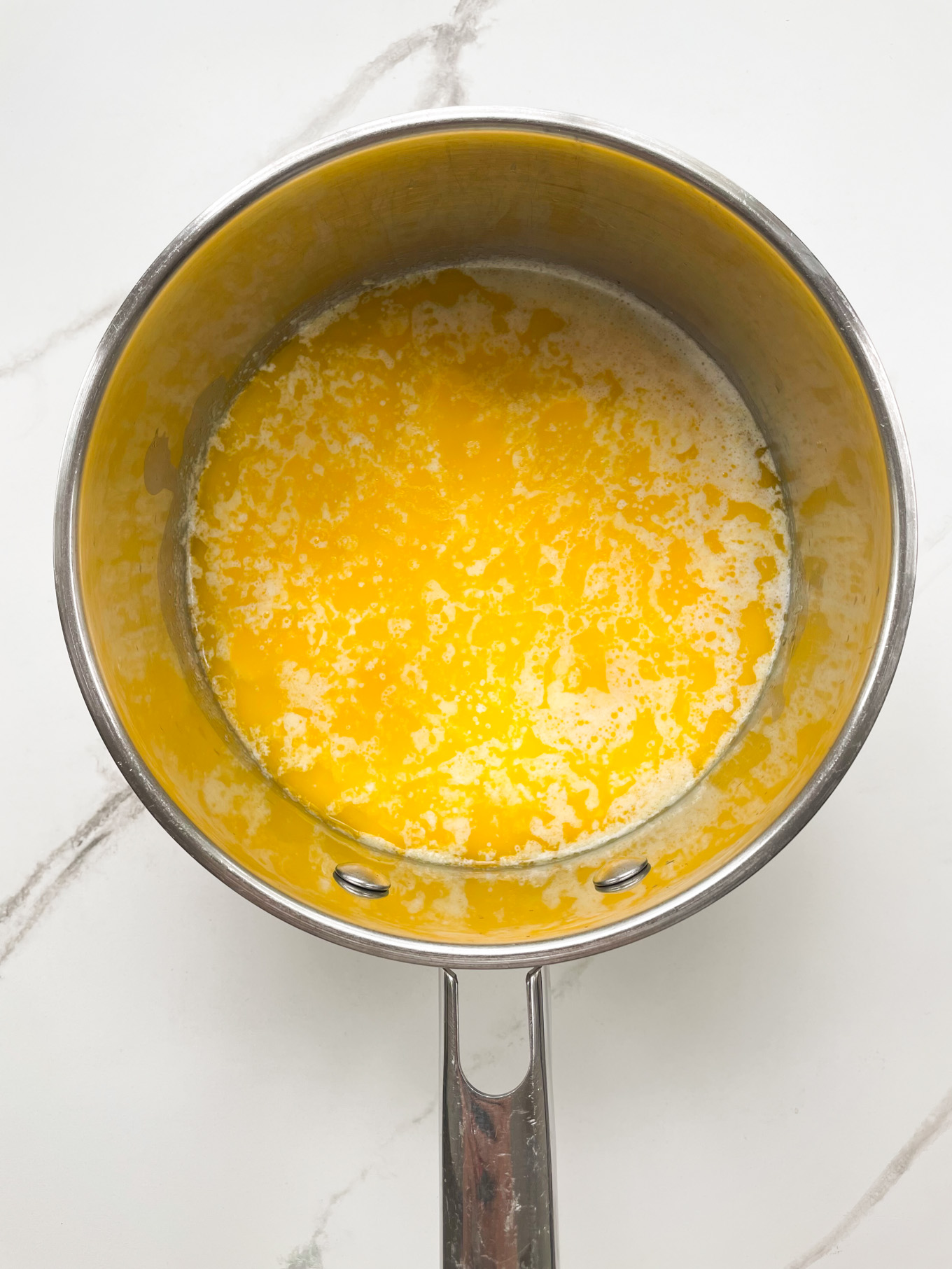 saucepan with melted butter and milk.