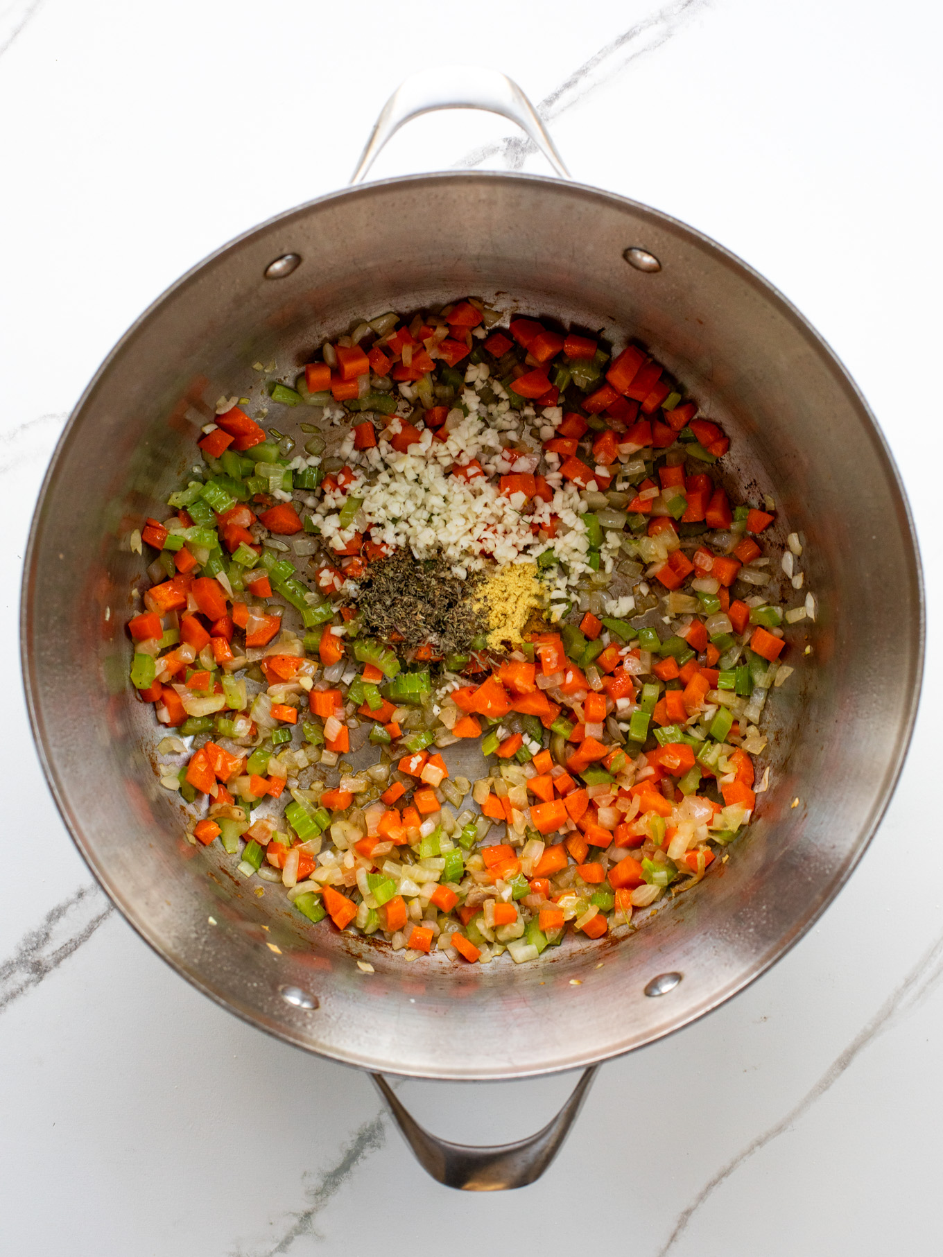 cooked onions, carrots, and celery in a dutch oven.