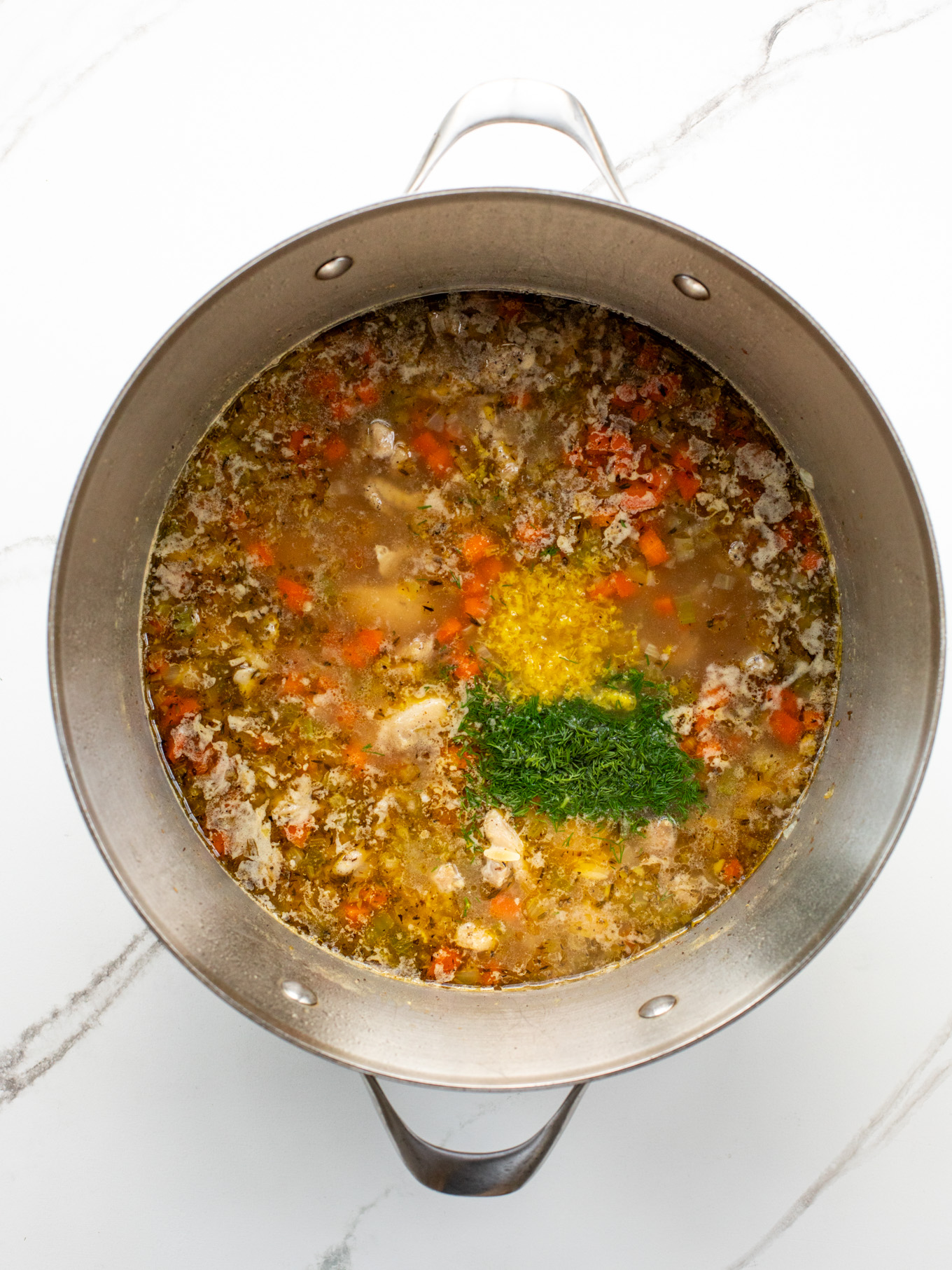 cooked orzo soup with fresh lemon zest and dill.