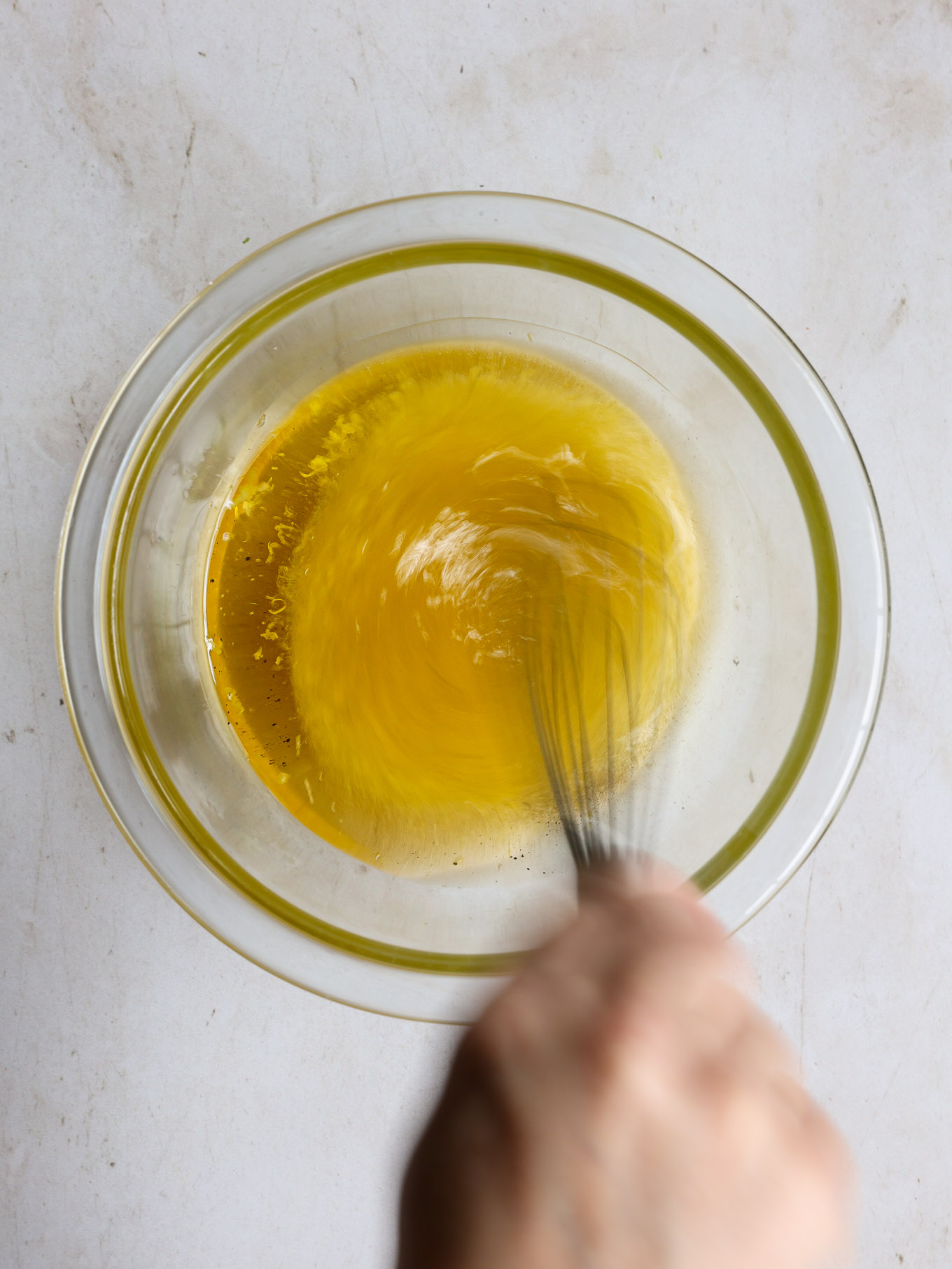 salad dressing in a glass bowl.