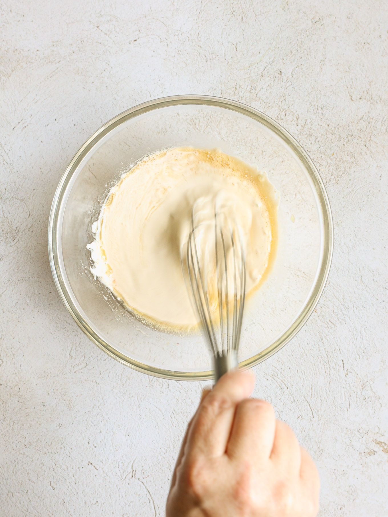 whisked dressing for pasta salad in a bowl.