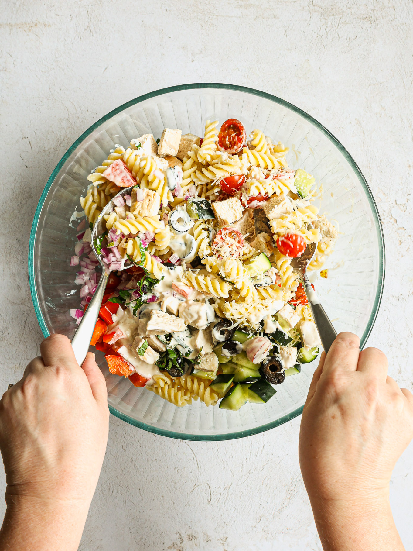 pasta salad tossed with dressing.