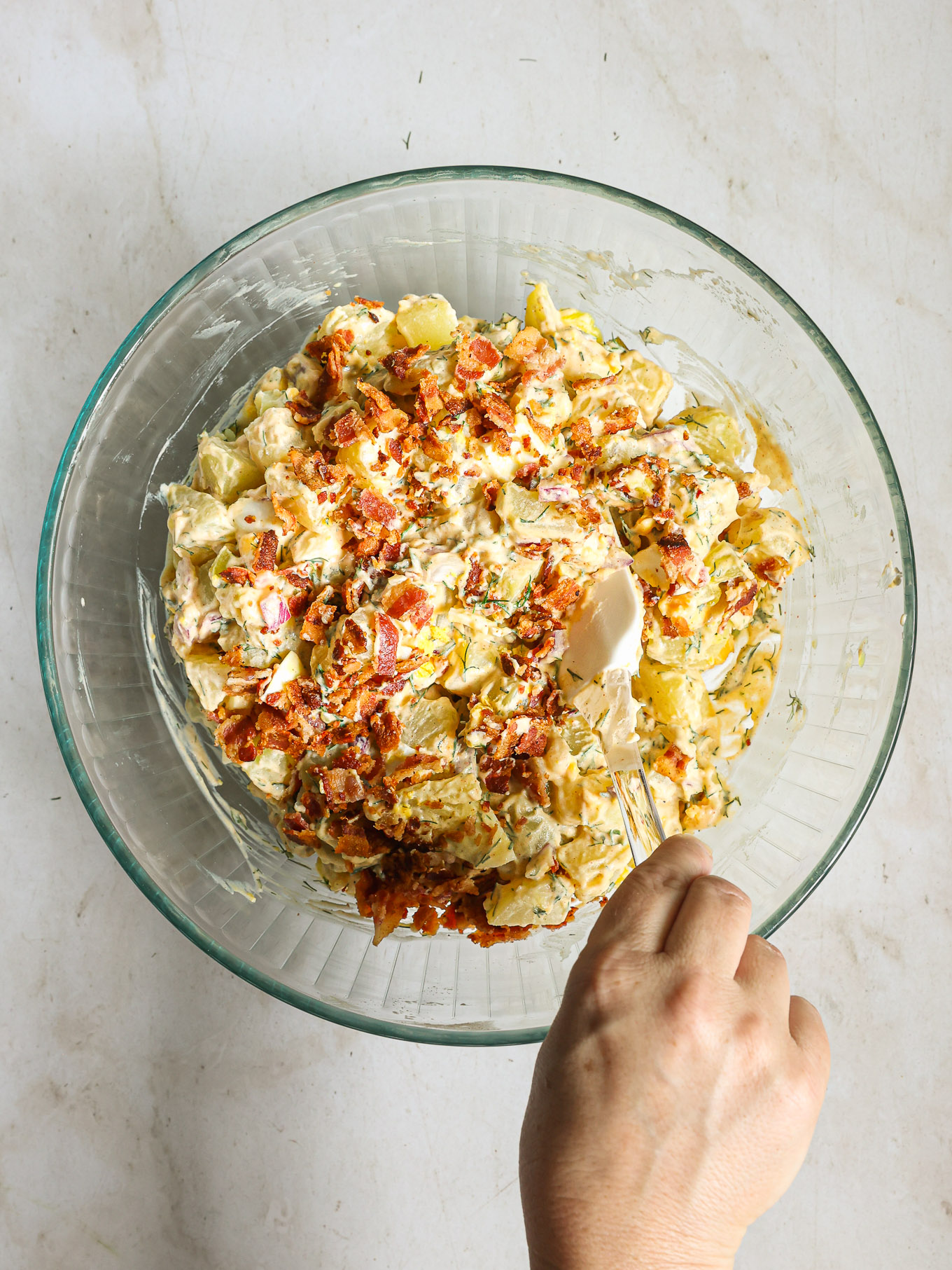potato salad topped with bacon.