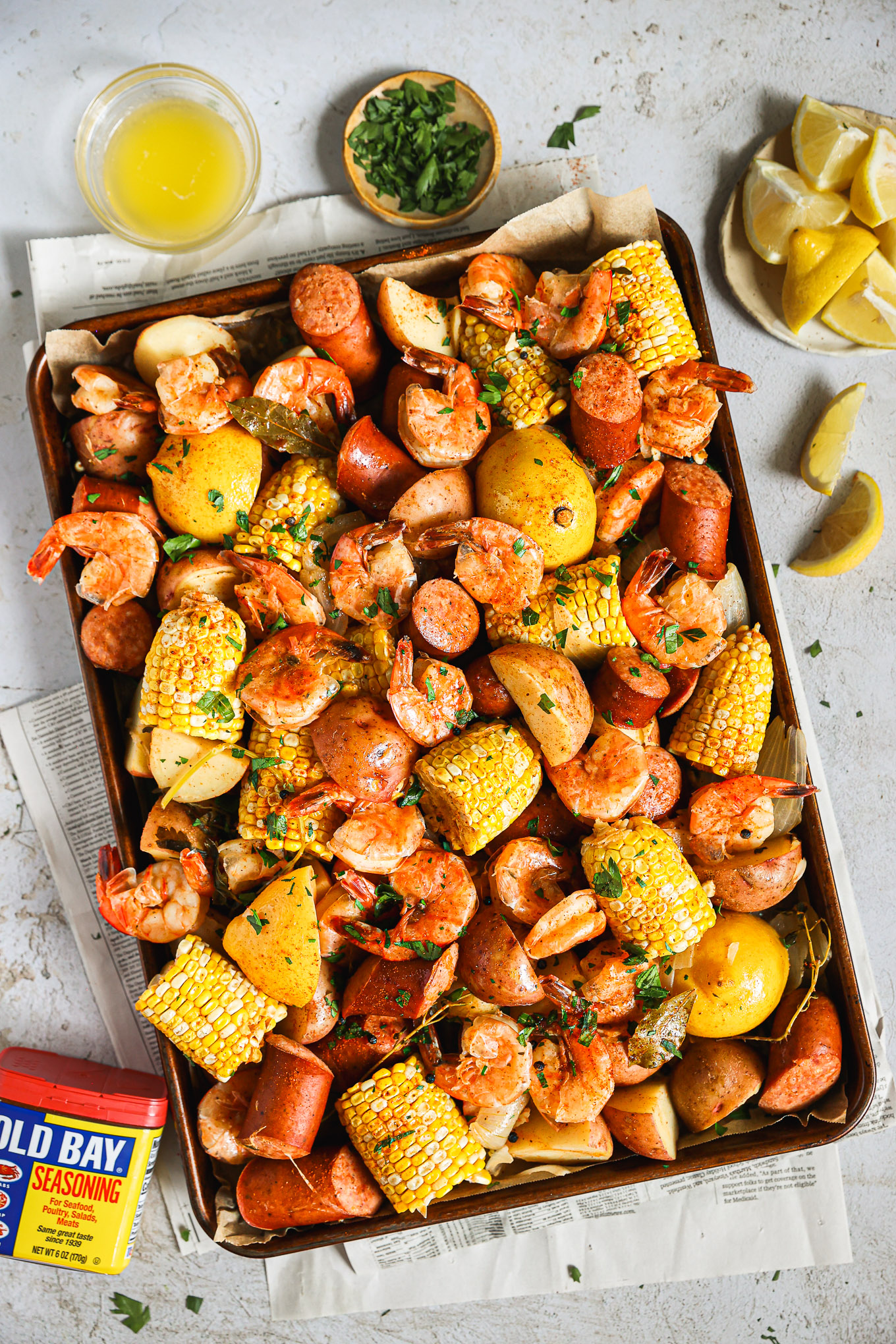 old bay shrimp boil on a baking sheet.