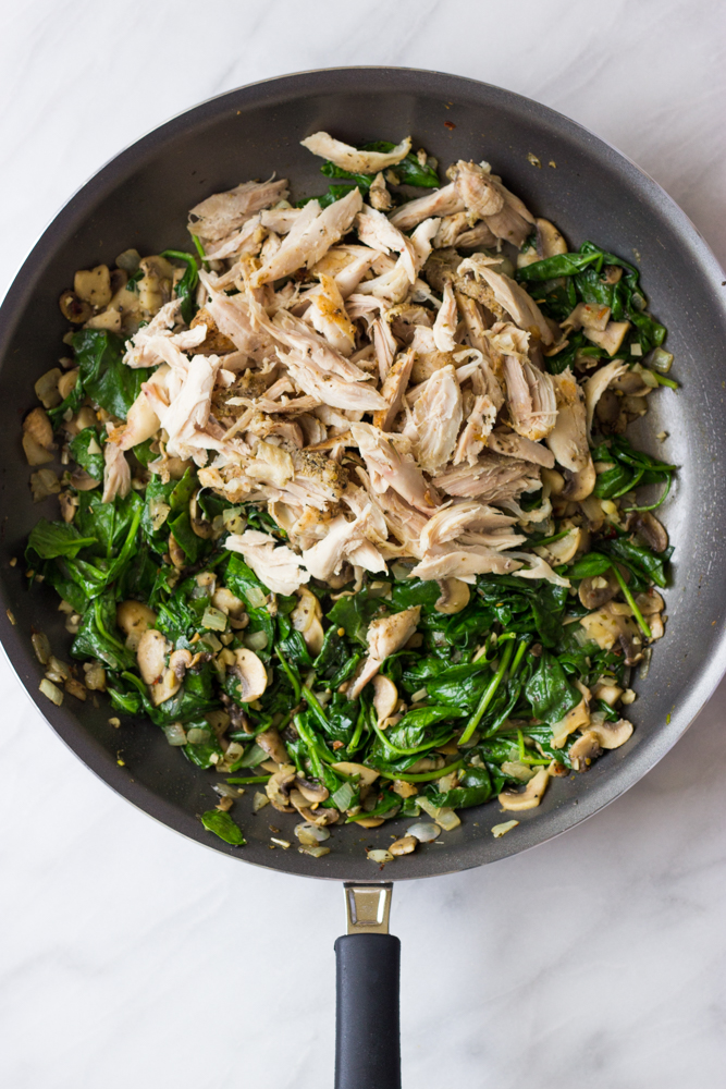 cooked chicken with spinach and mushrooms.