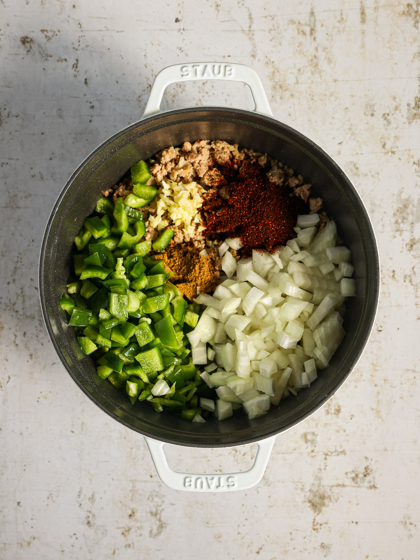 cooked turkey with vegetables in a pot.