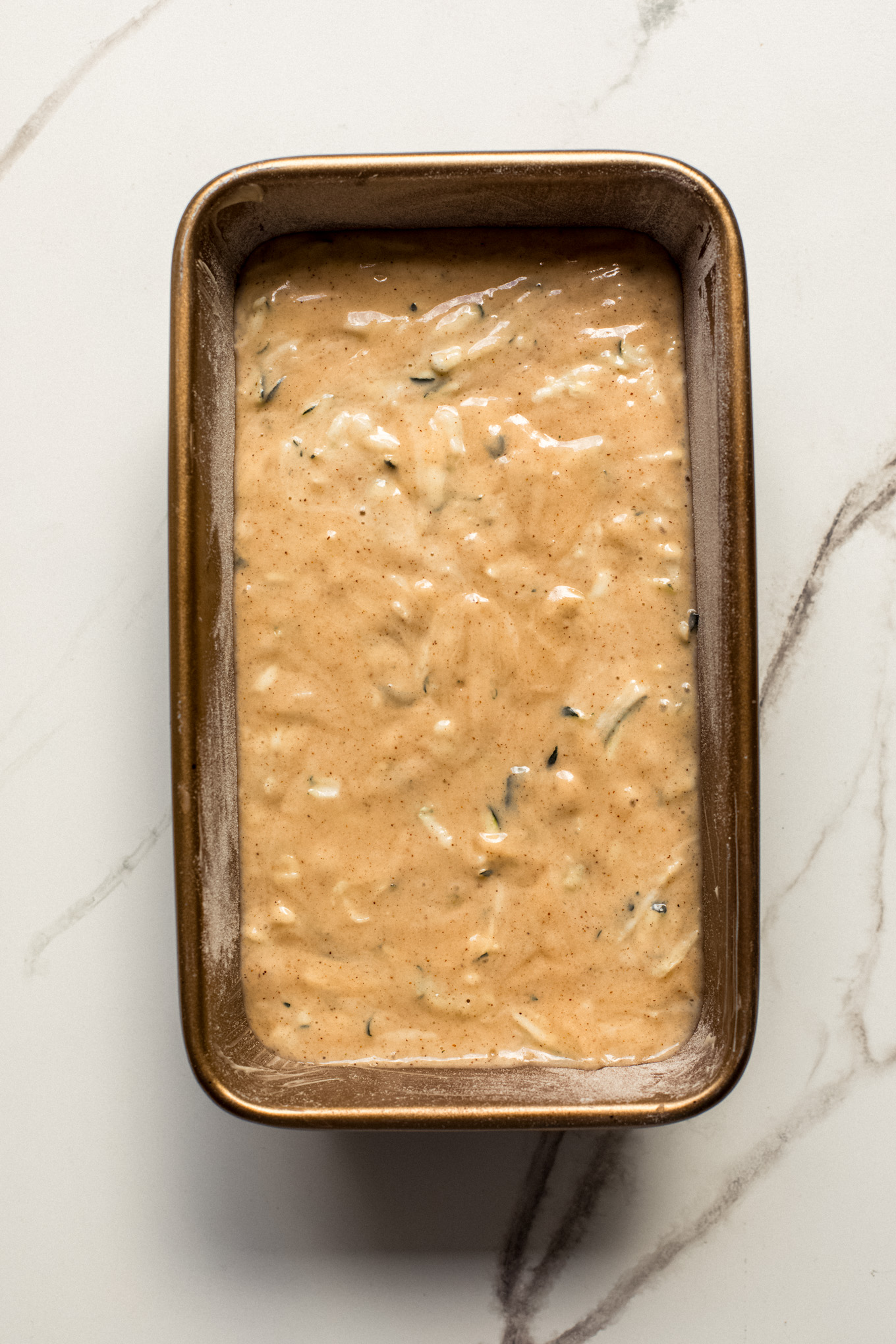 batter for zucchini bread in a loaf pan.