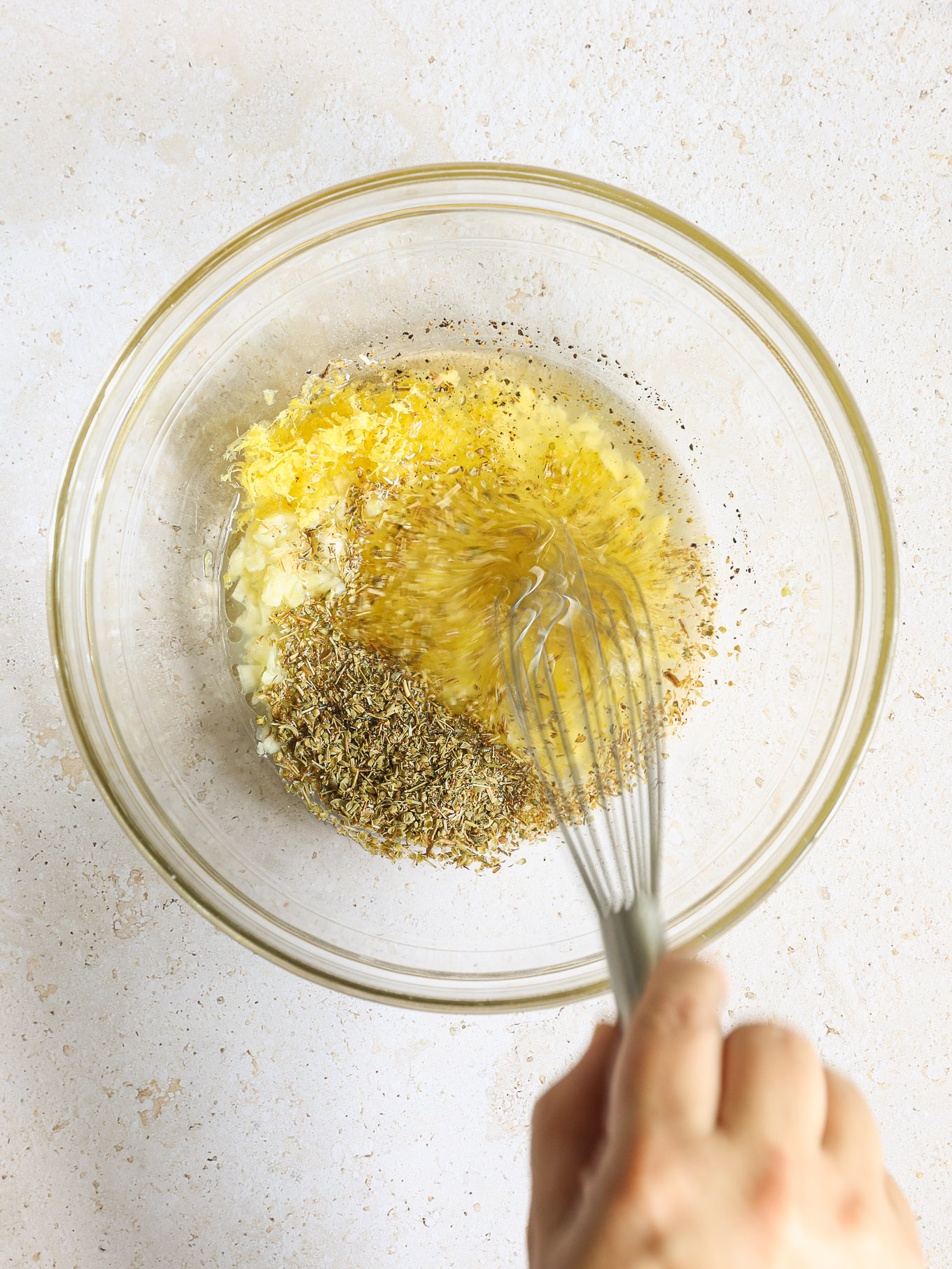 lemon garlic marinade in a glass bowl.