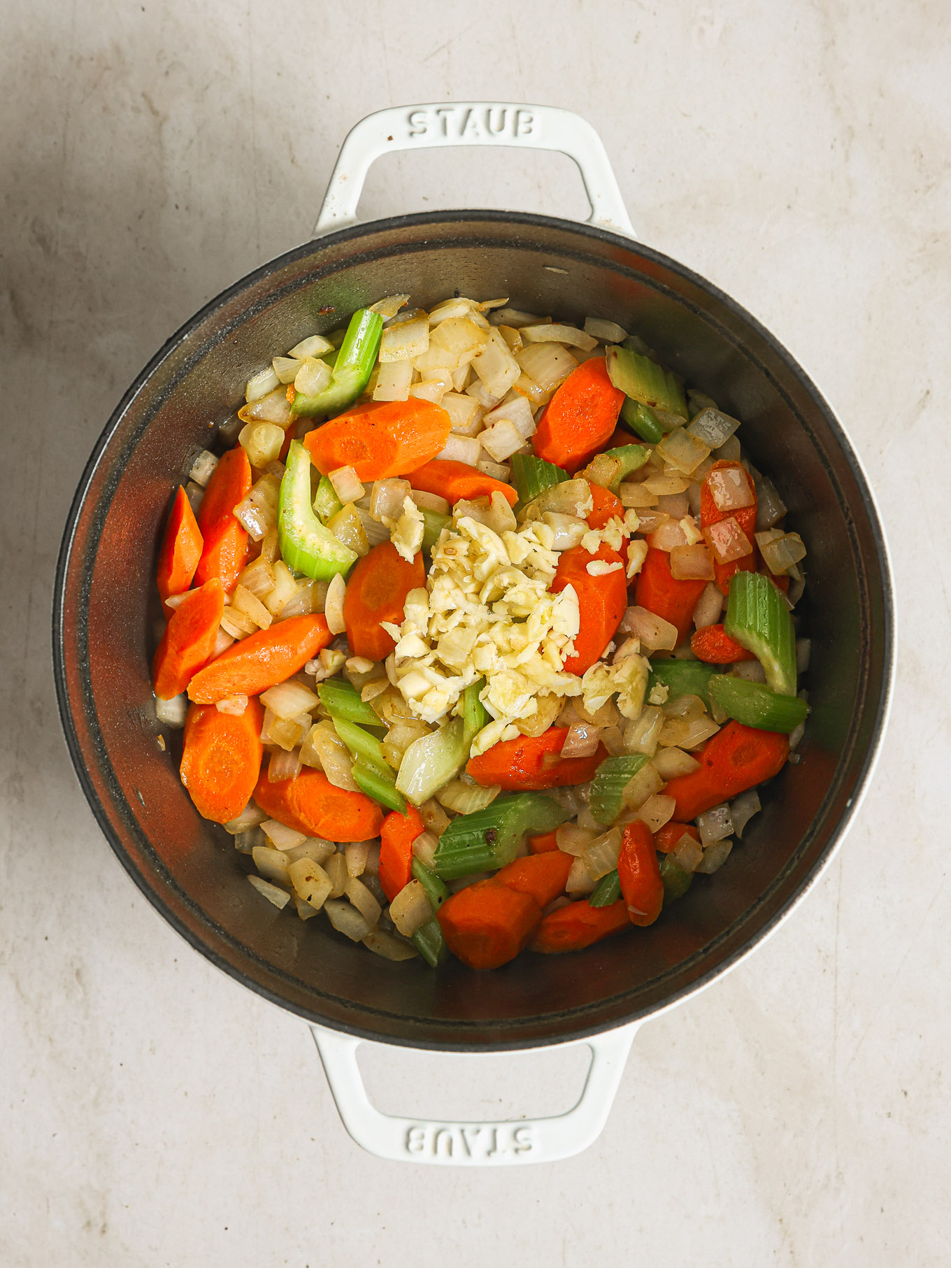 sauteed vegetables in a dutch oven.