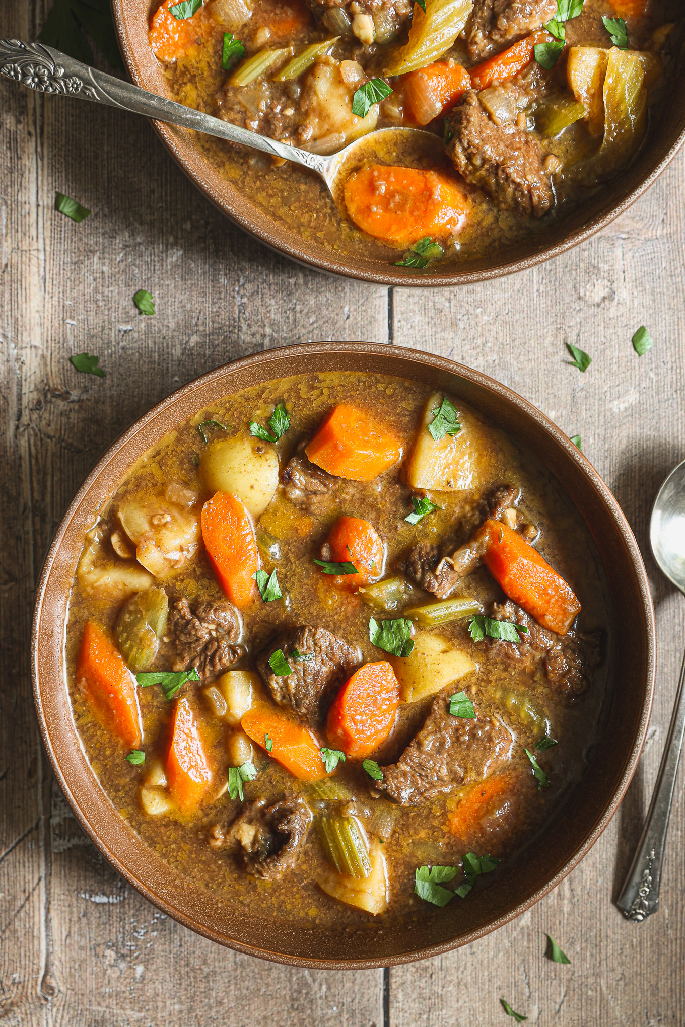 beef stew in a brown bowl.