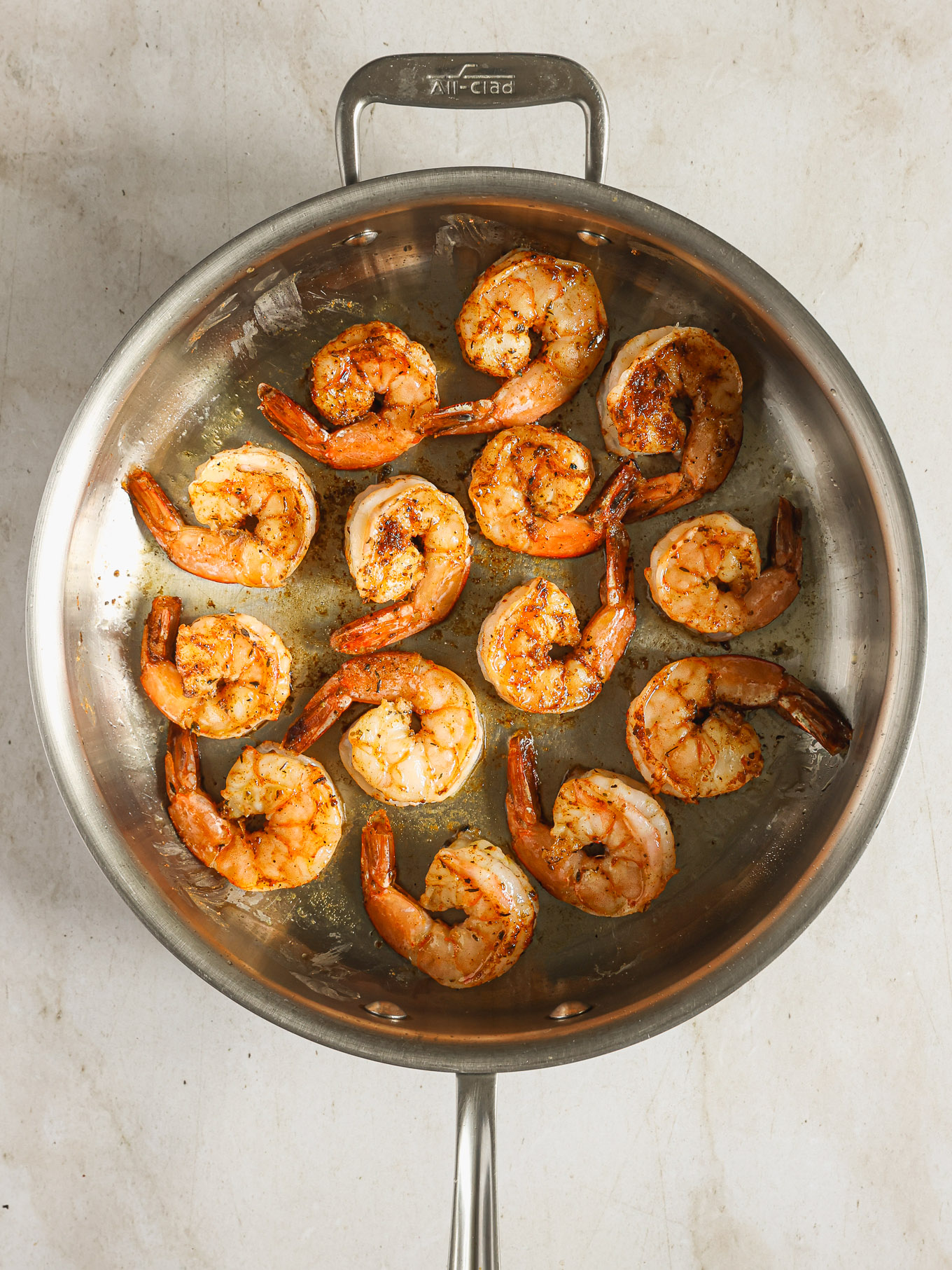 cooked shrimp in a saute pan.