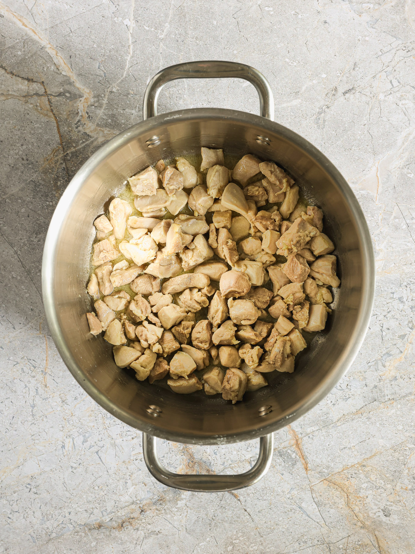 cooked chicken in a pot.