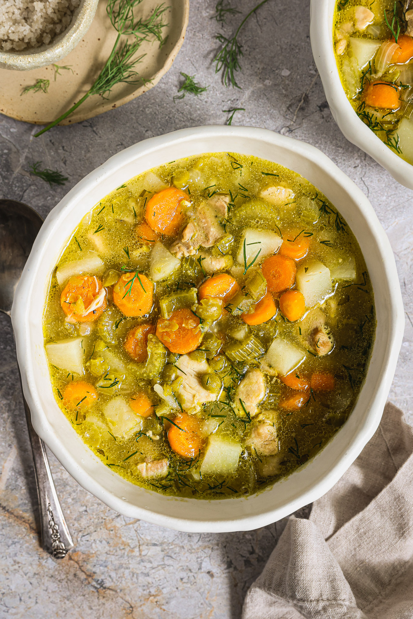 chicken pea soup in a white bowl.