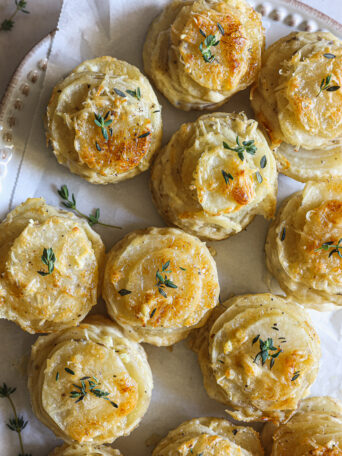 potato stacks on a white platter.