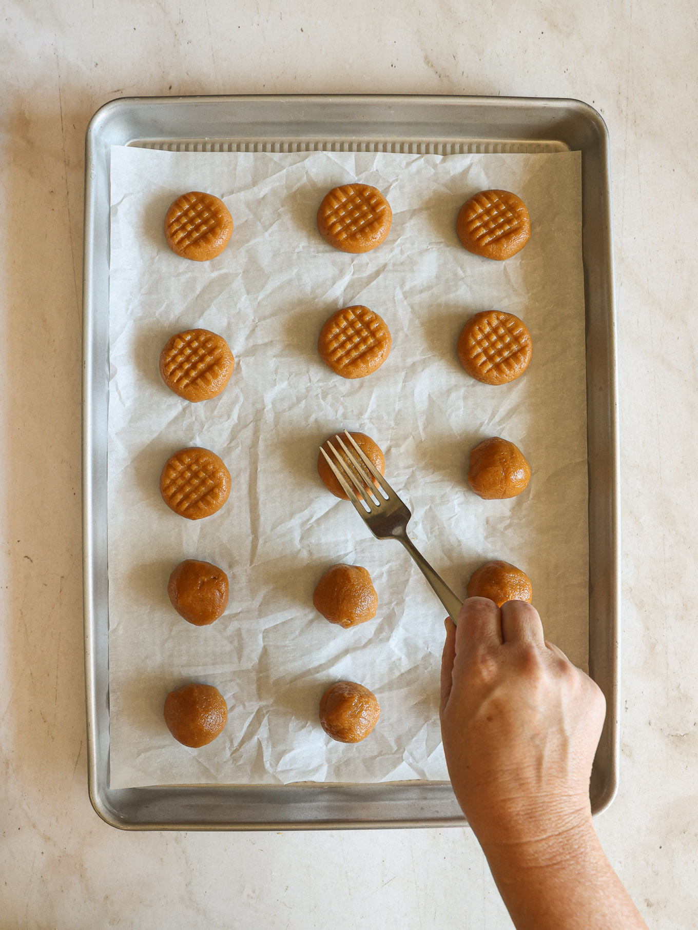 peanut butter cookies flattened with a fork.