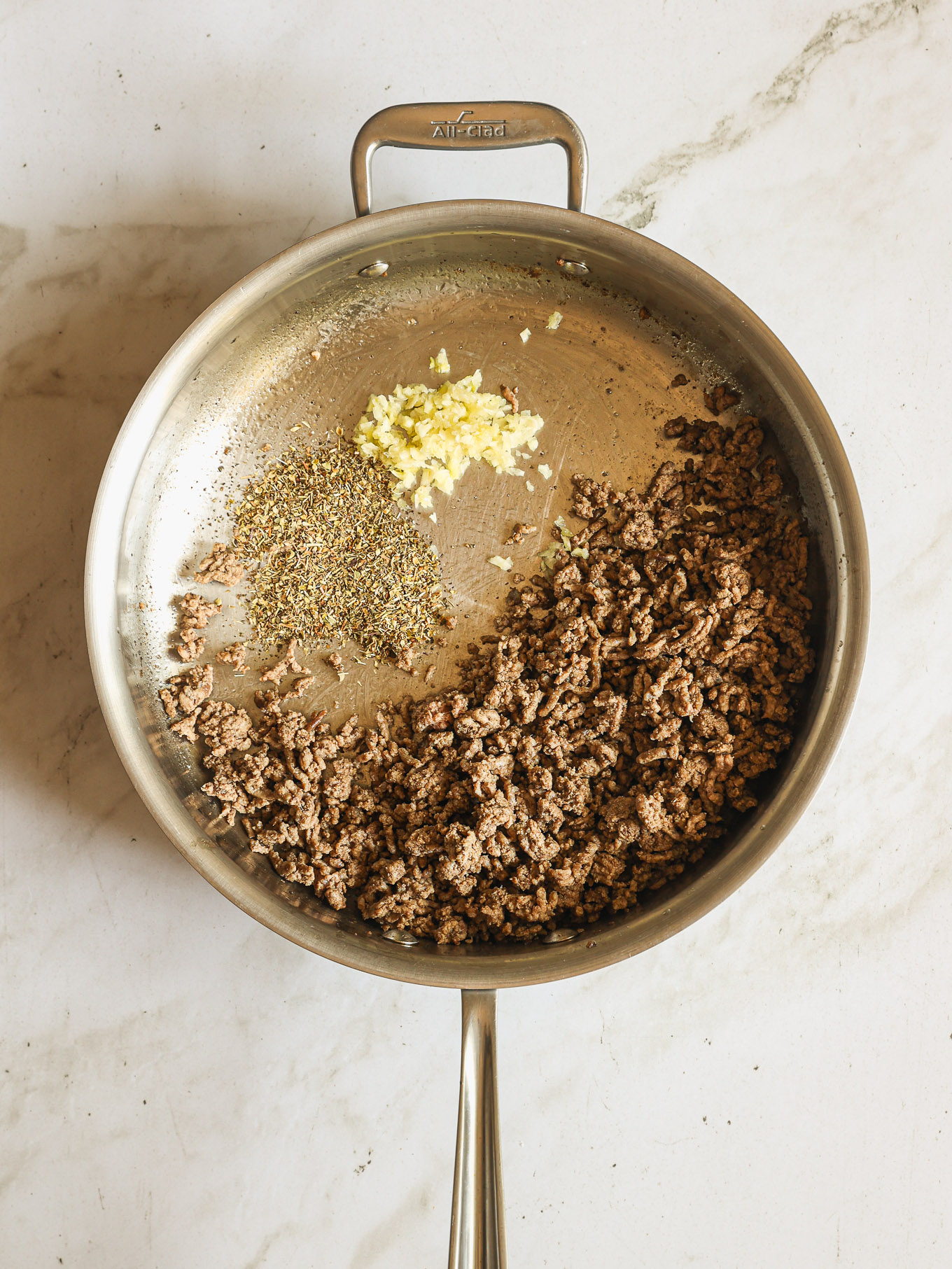 ground beef and spices in a skillet.