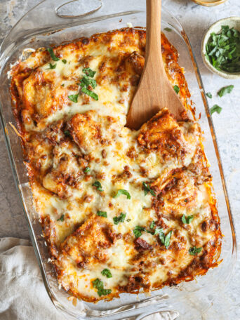 baked ravioli in a glass baking dish.