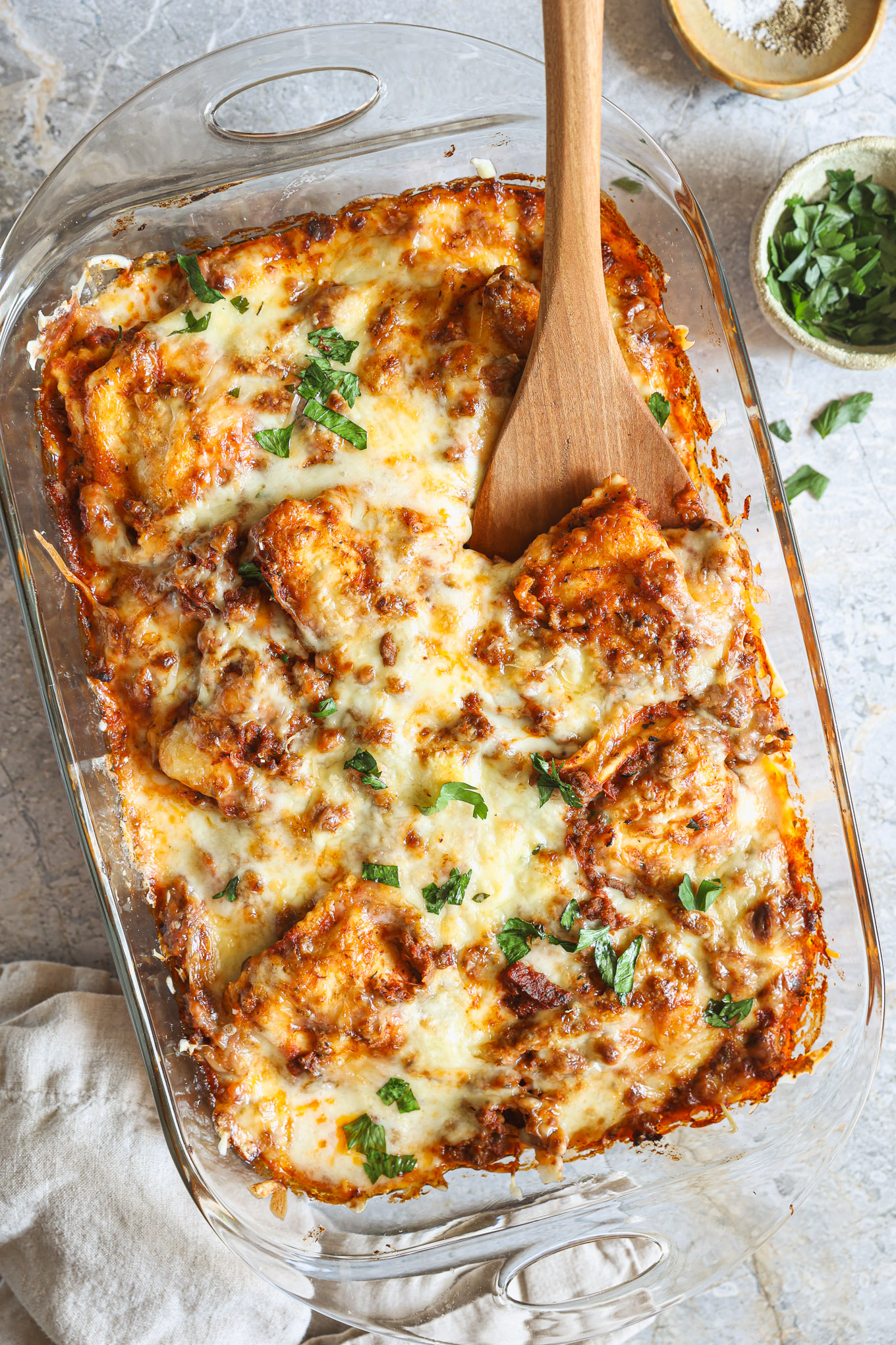 baked ravioli in a glass baking dish.