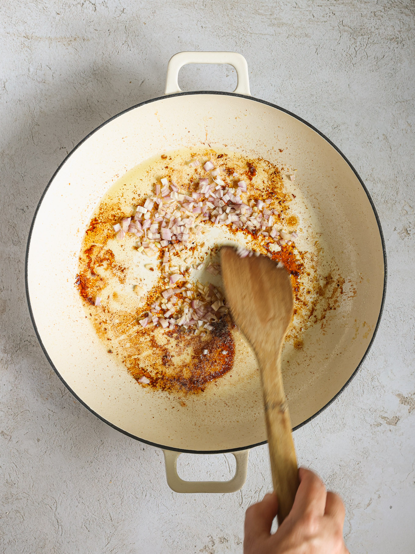 shallots cooking in butter in a skillet.