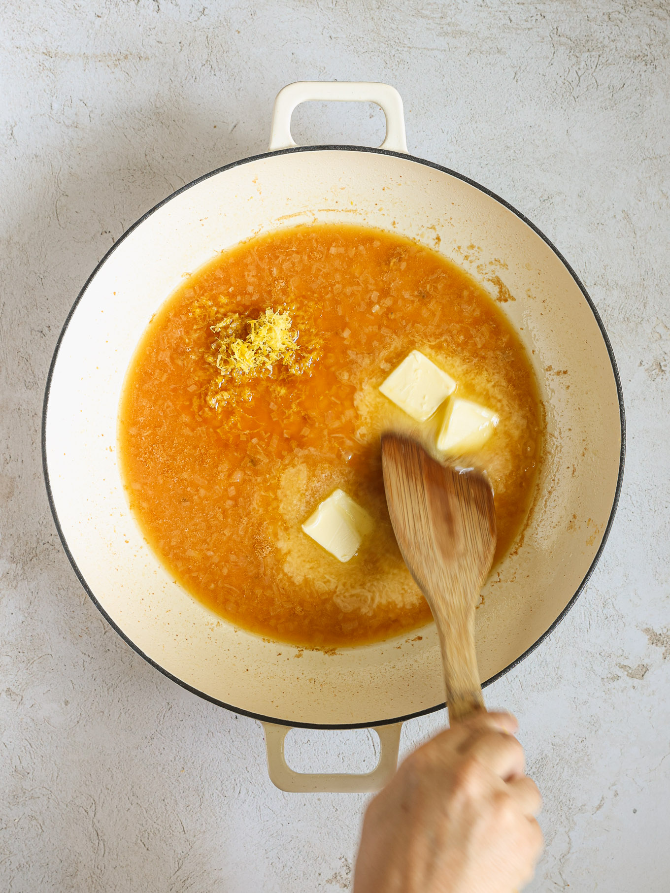 butter and lemon zest whisked into sauce.
