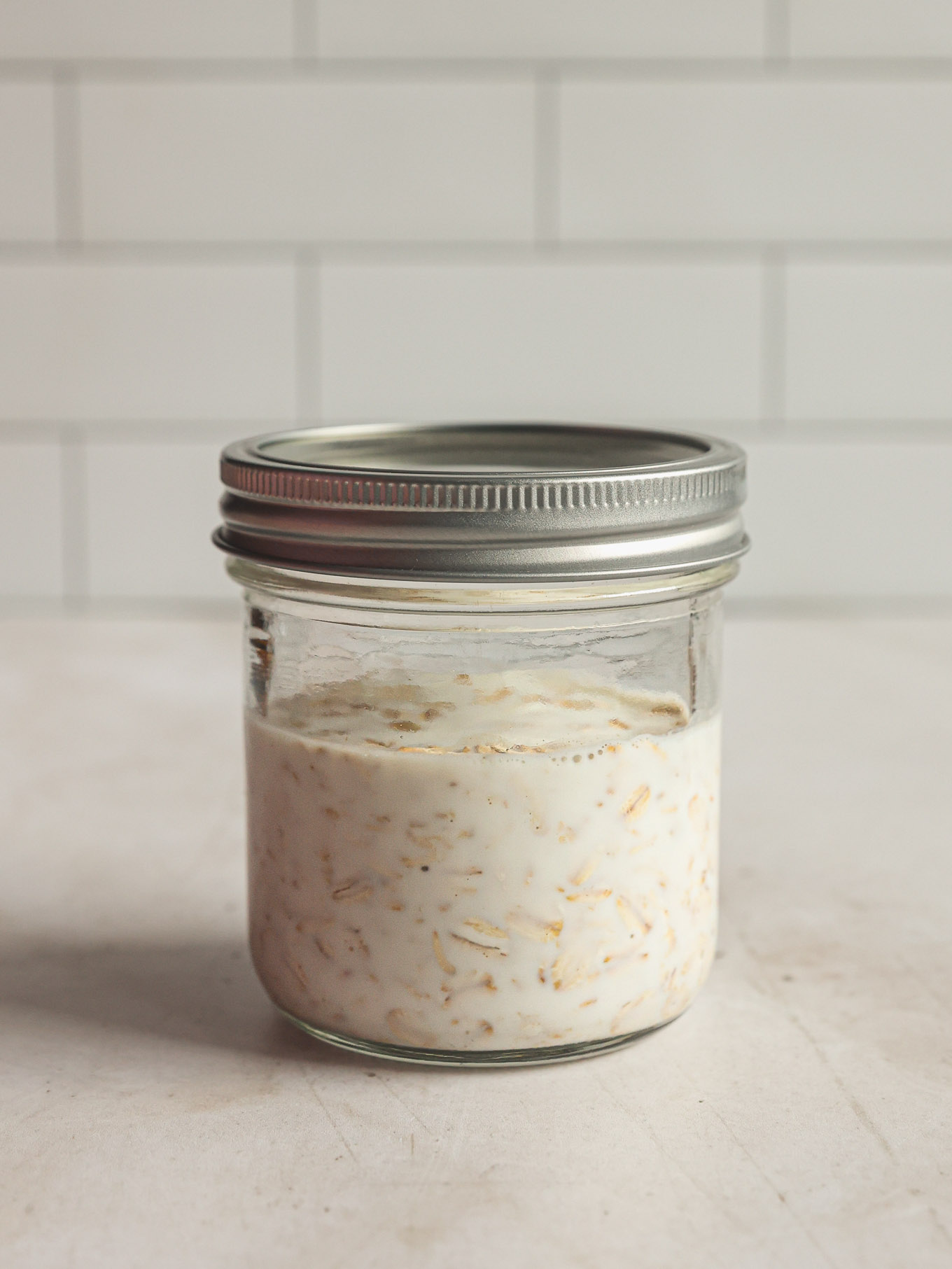 closed jar with oats and milk.