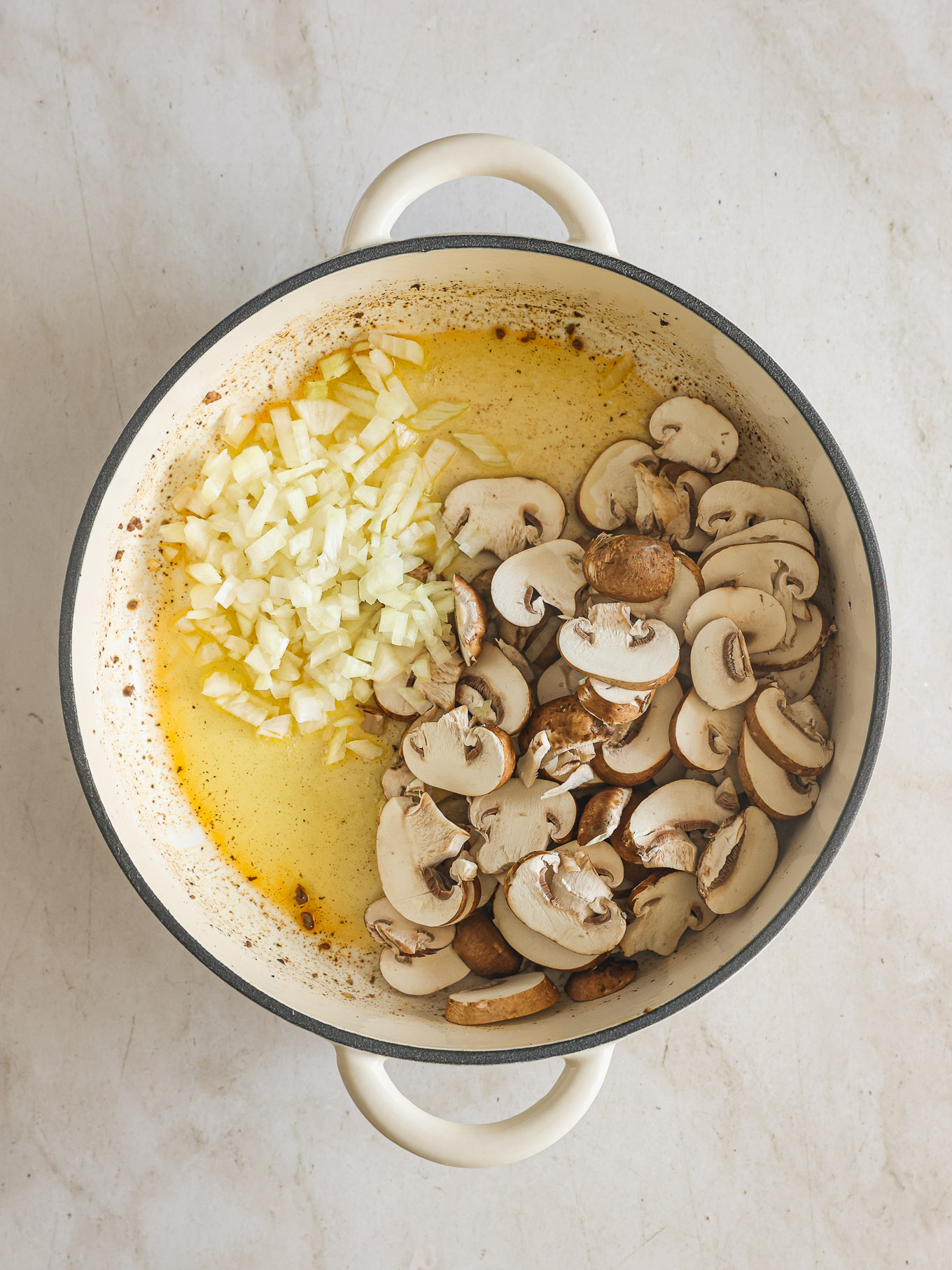 mushrooms with onions in a skillet.