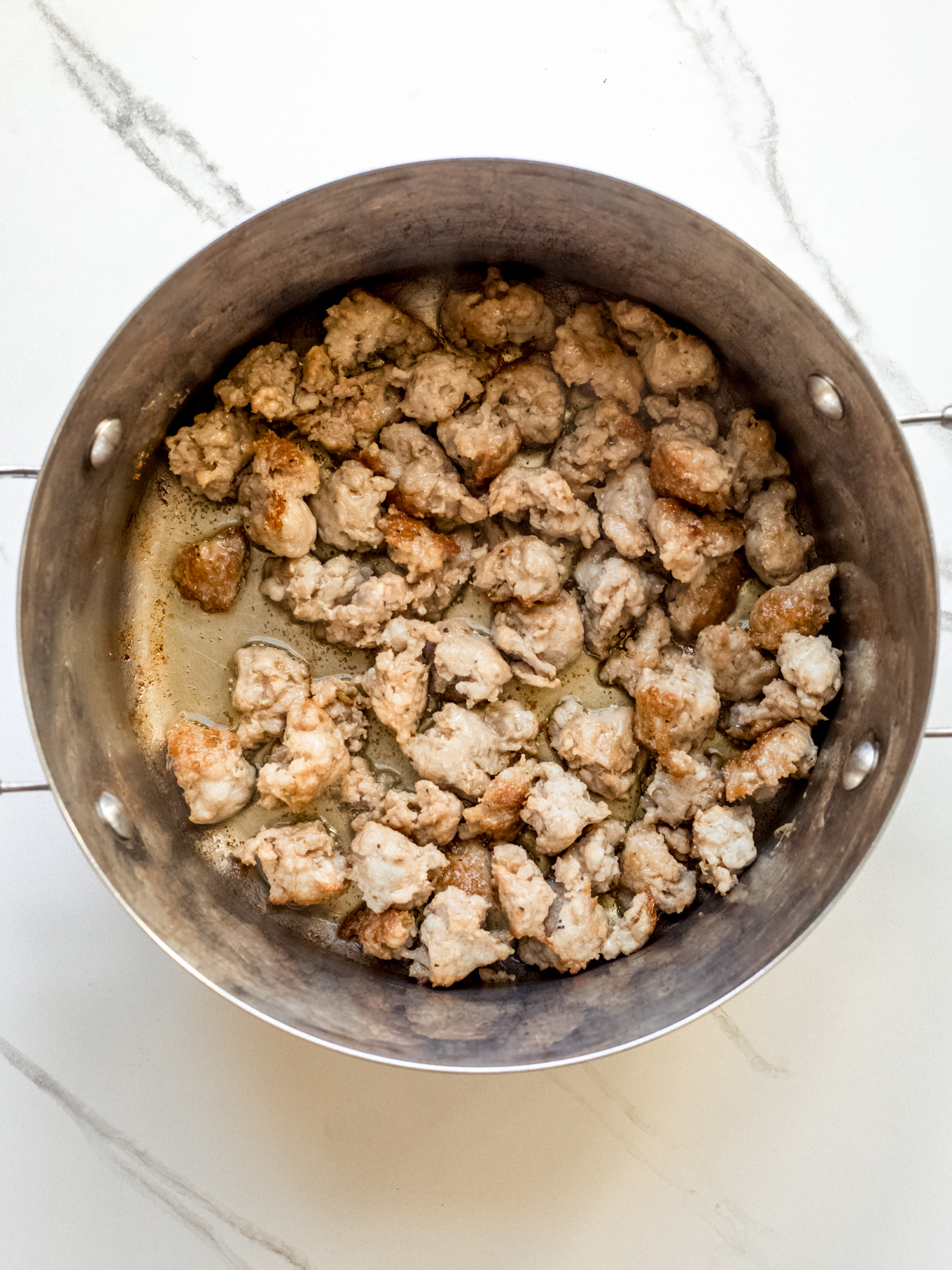 cooked sausage in a pot.