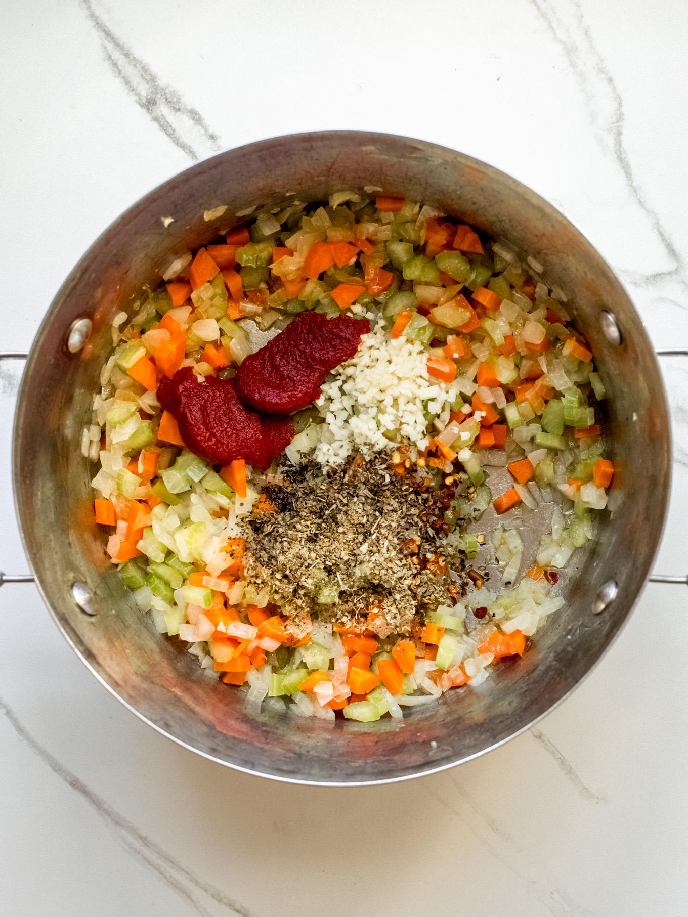 cooked vegetables and spices in a pot.