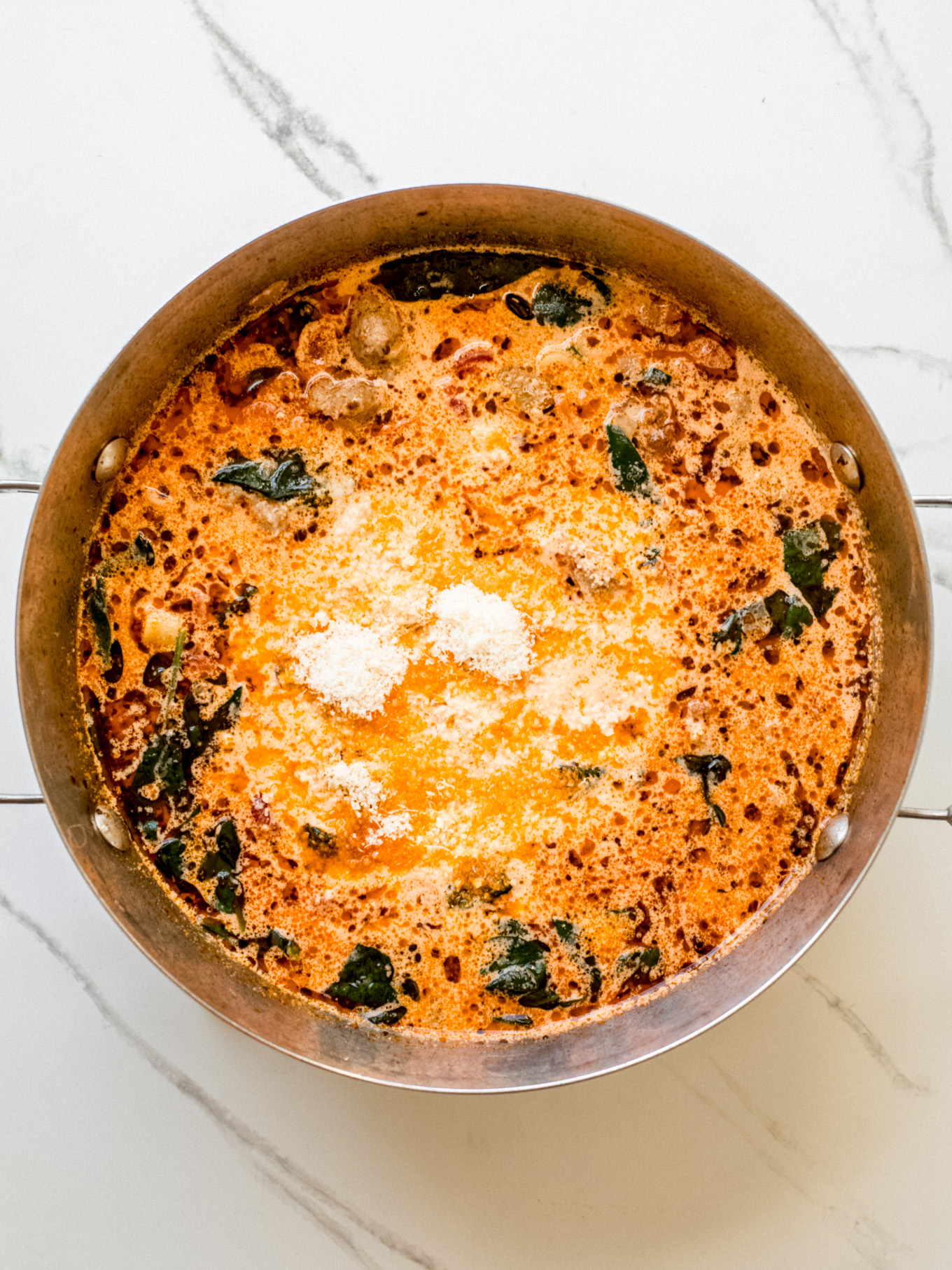 parmesan cheese in a soup pot.