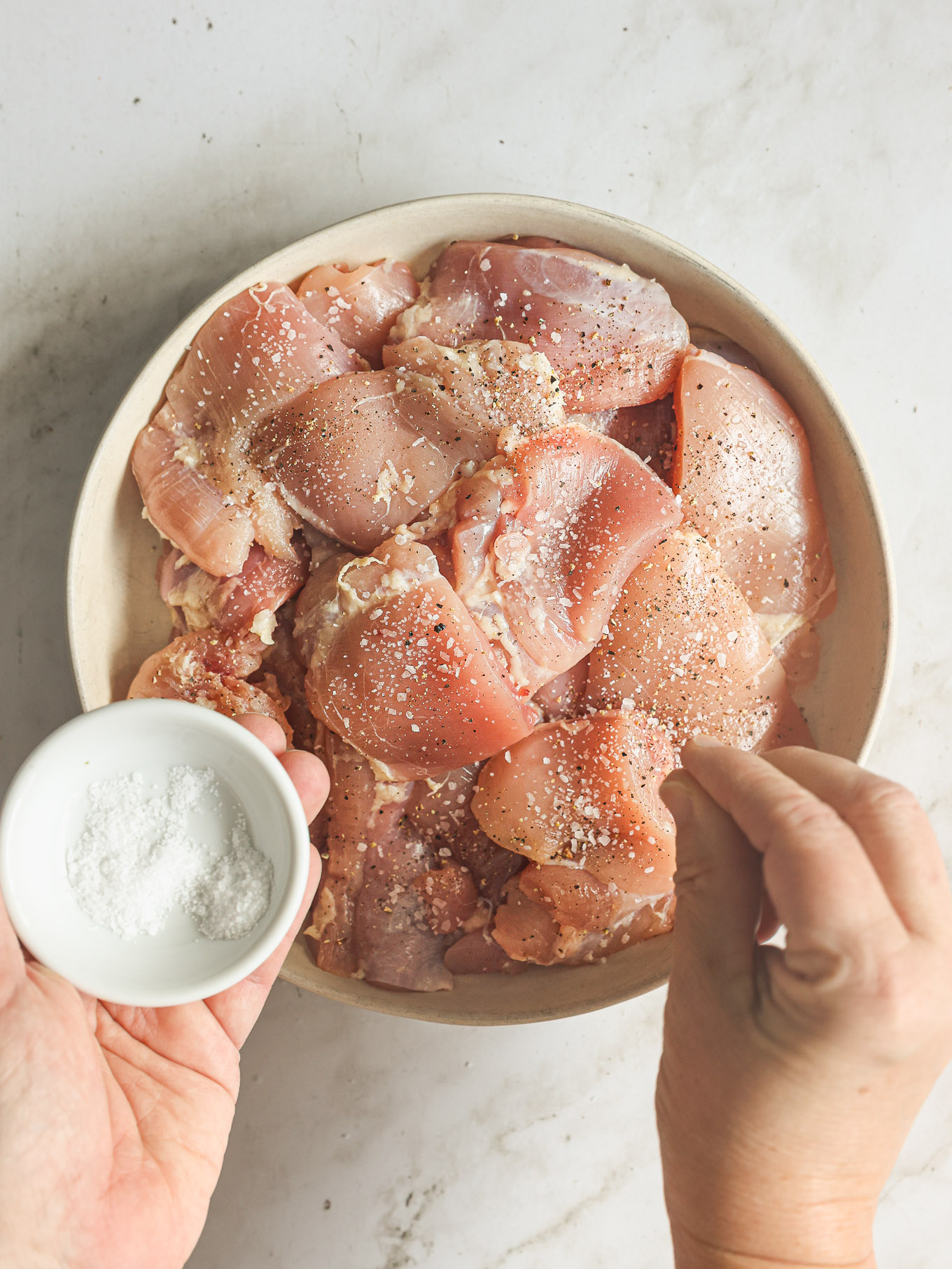 chicken thighs seasoned with salt.