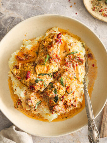 chicken in sauce over mashed potatoes.