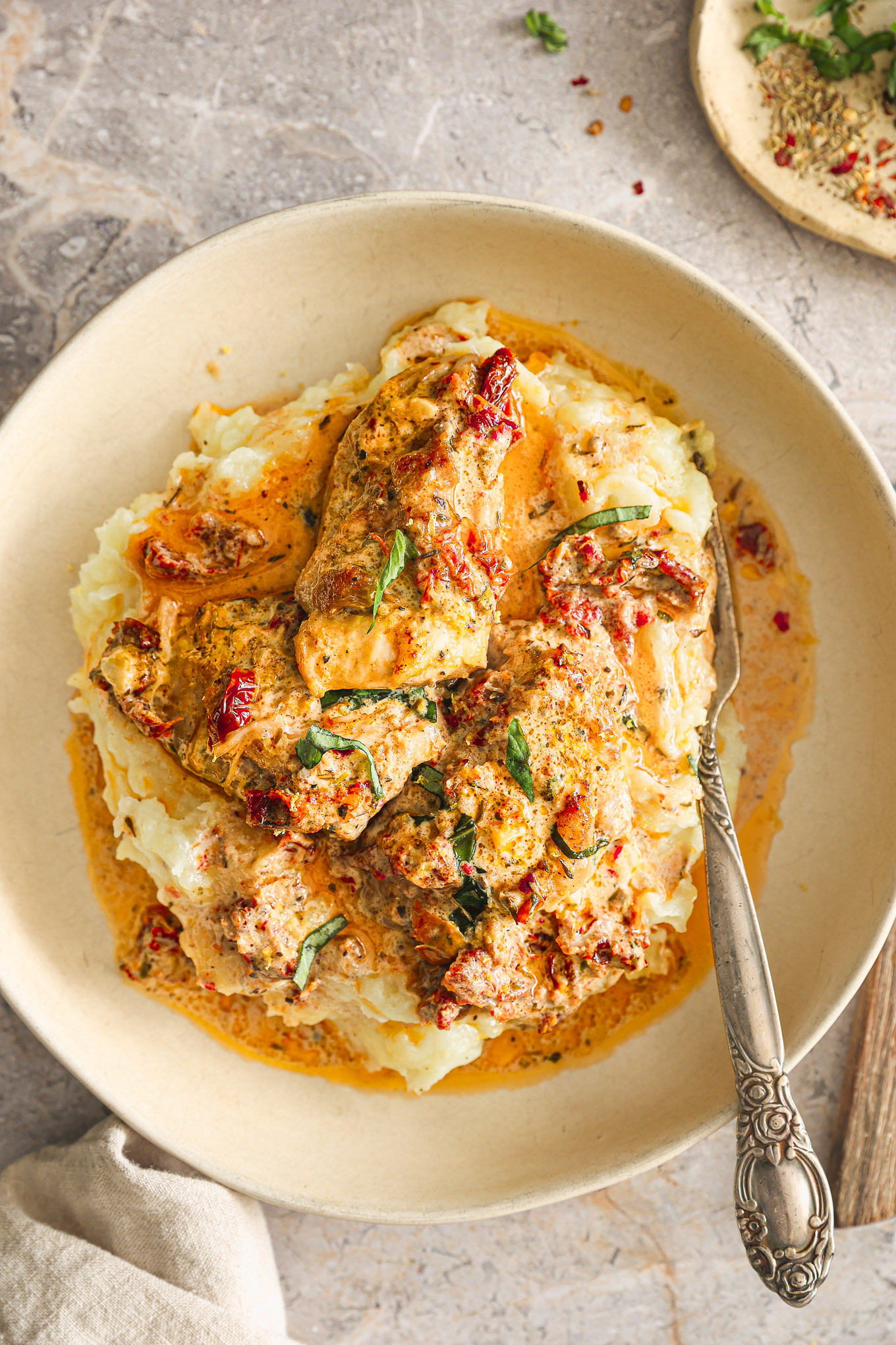 chicken in sauce over mashed potatoes.