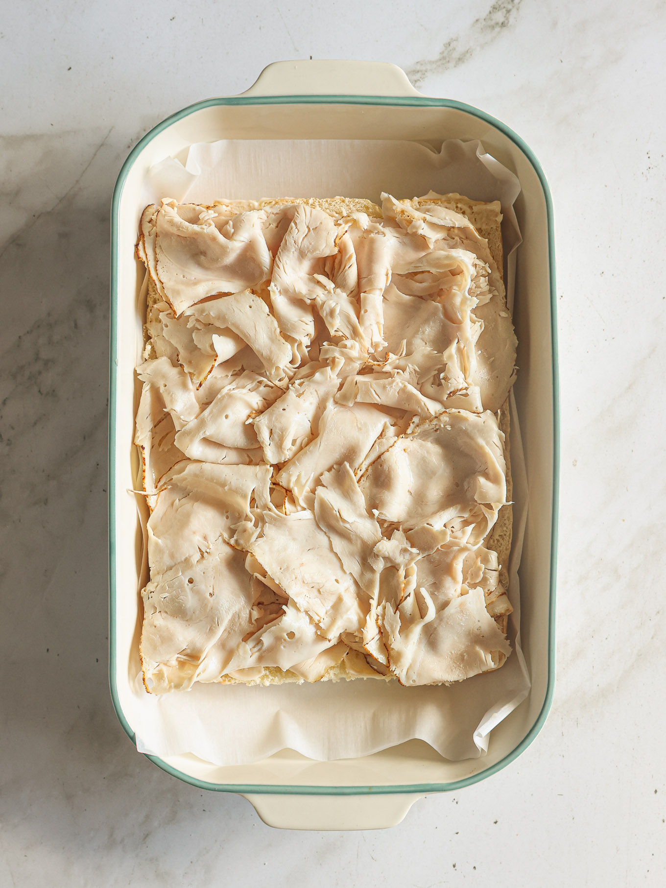 turkey layered on hawaiian rolls.