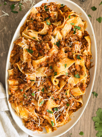 pasta bolognese in oval platter.