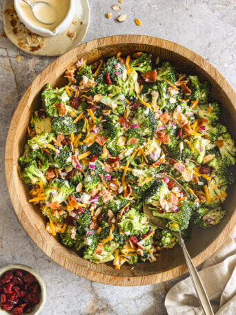broccoli salad in a wooden bowl.