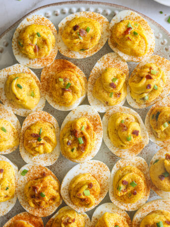 close up of deviled eggs on a platter.