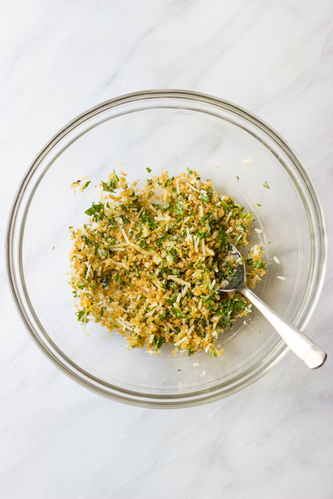 panko crumbs with herbs in a glass bowl.