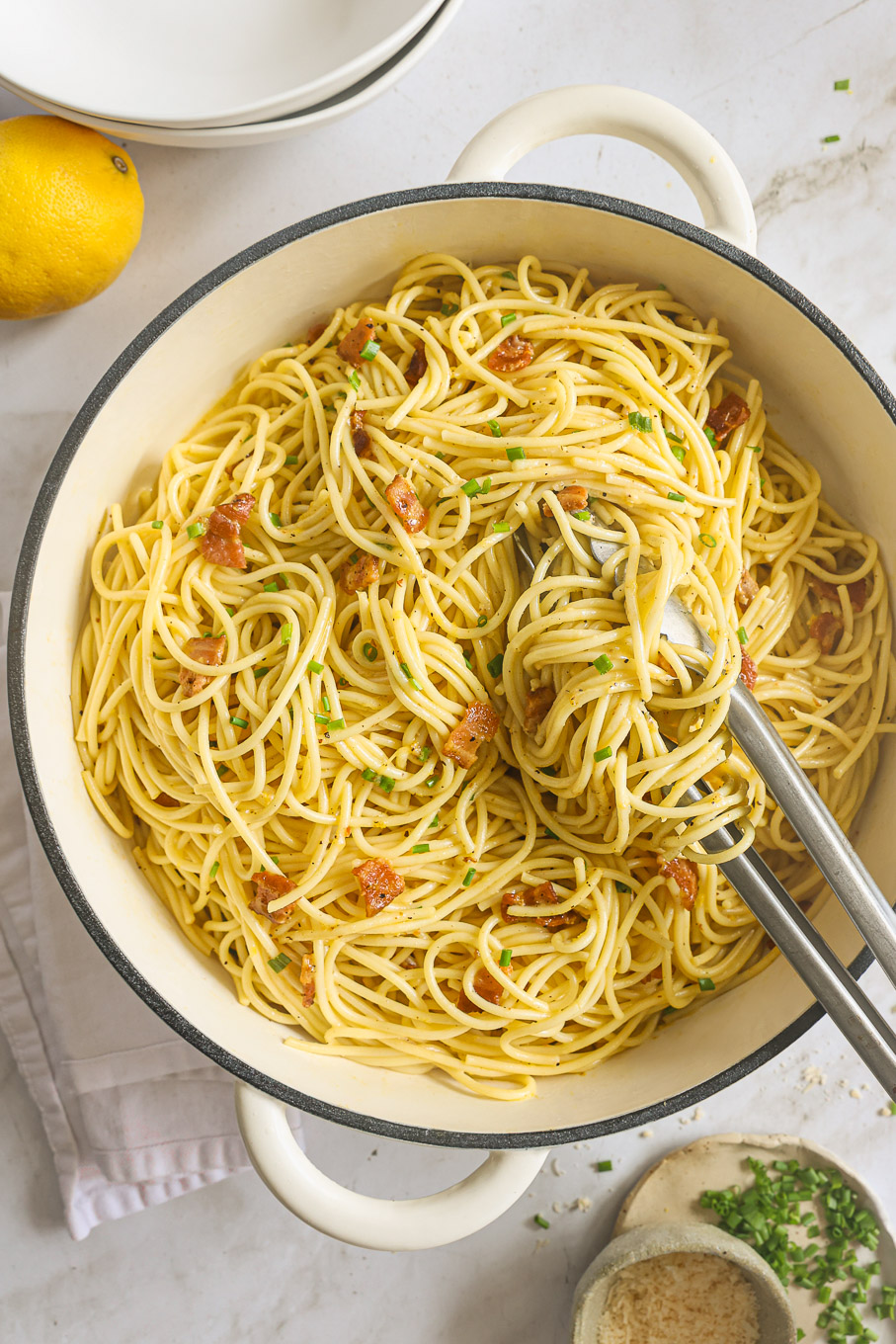 pasta carbonara in a white pan.