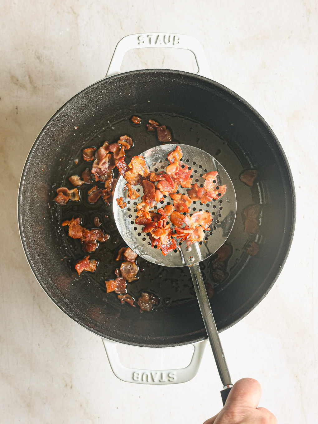 cooked bacon in a pot.