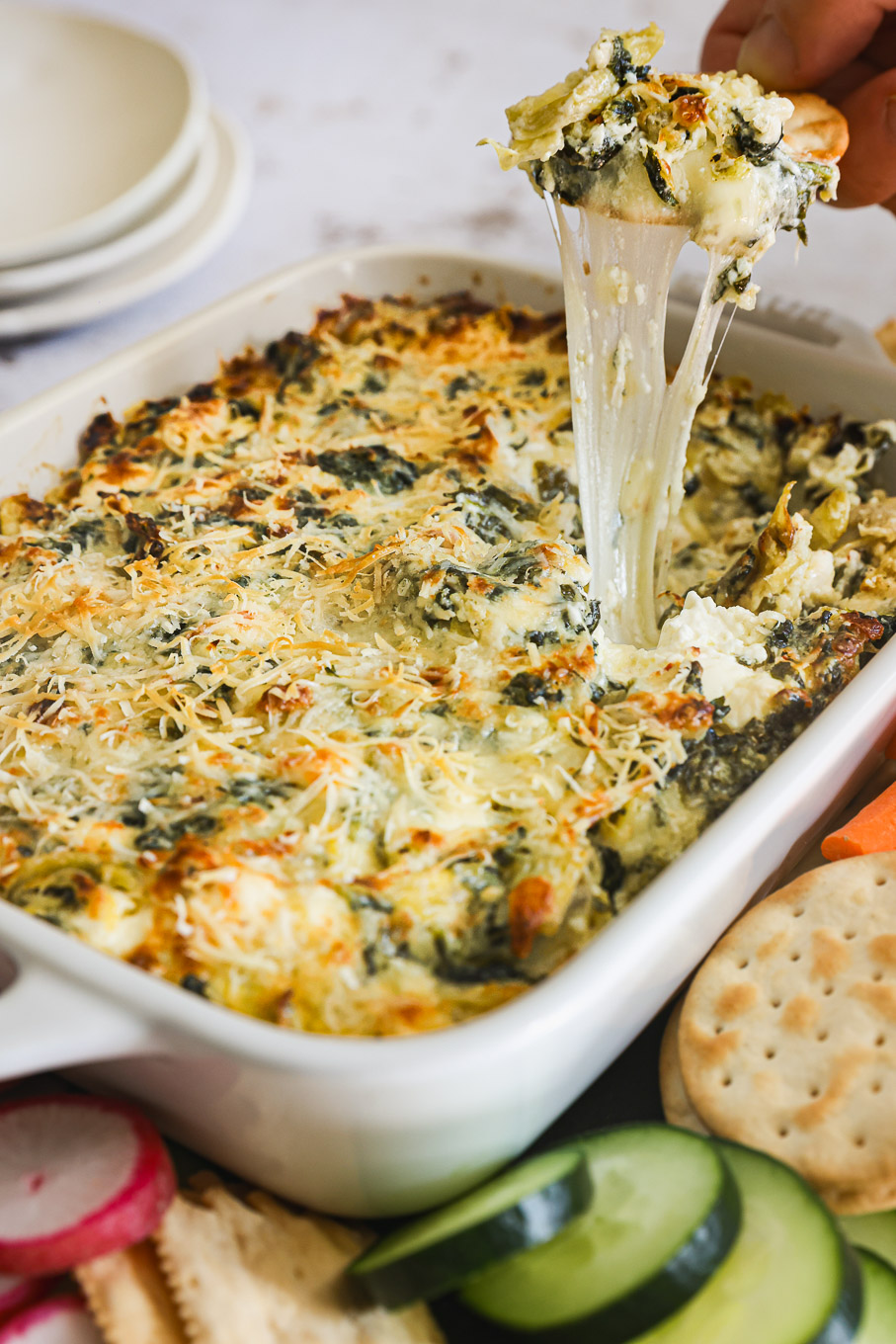close up baked artichoke spinach dip.