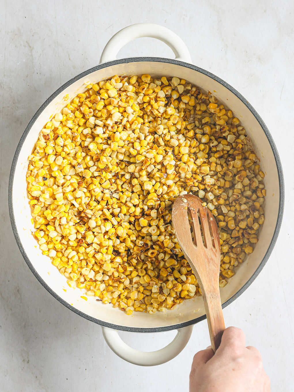 charred corn in a skillet.