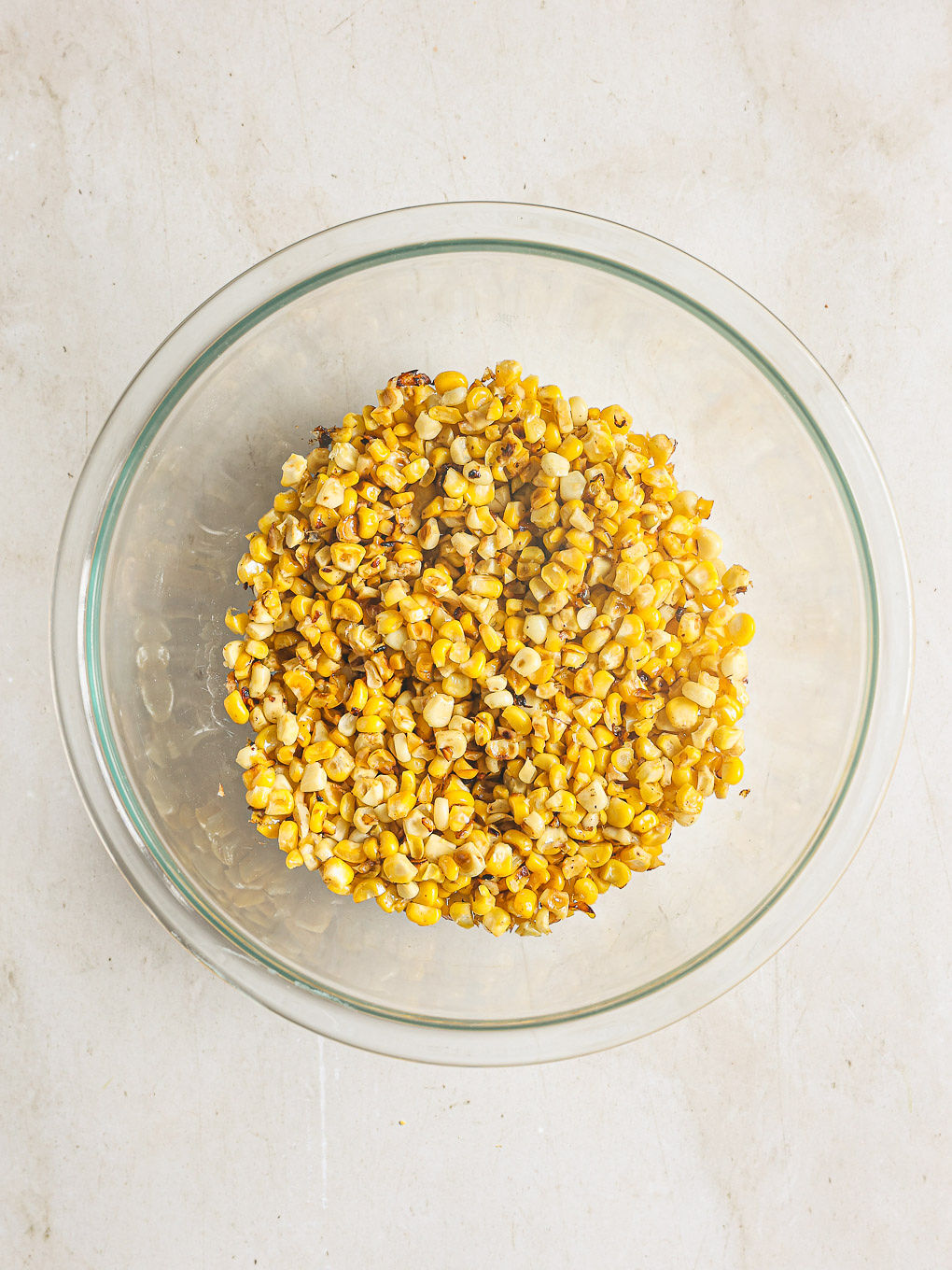 charred corn in a glass bowl.