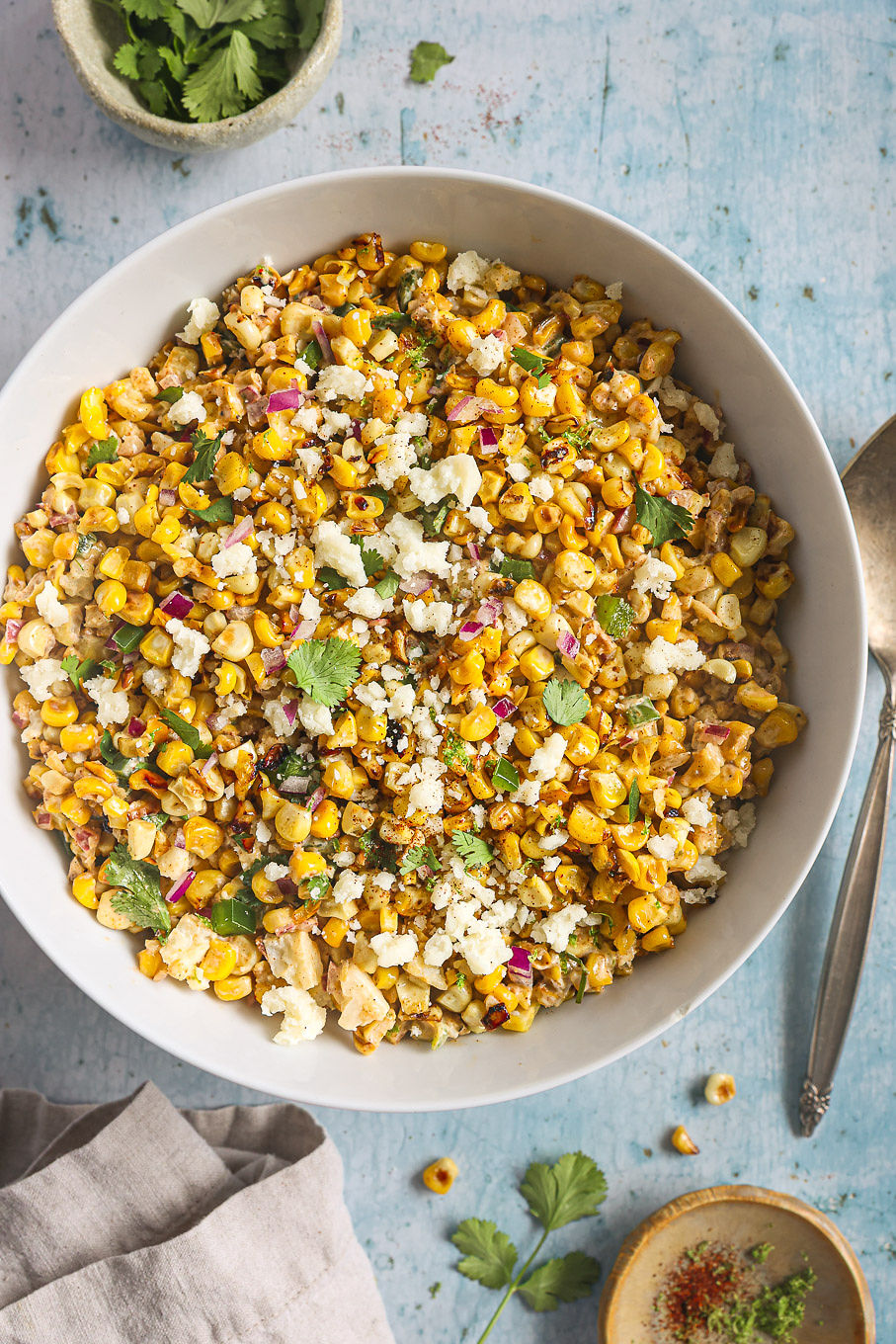 corn salad with cheese in a bowl.